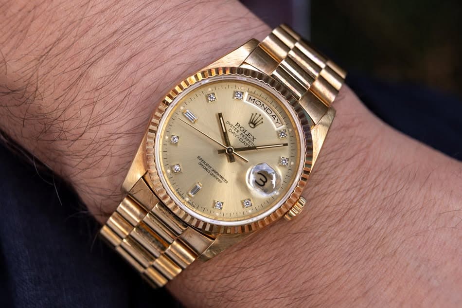 May be an image of wrist watch and text