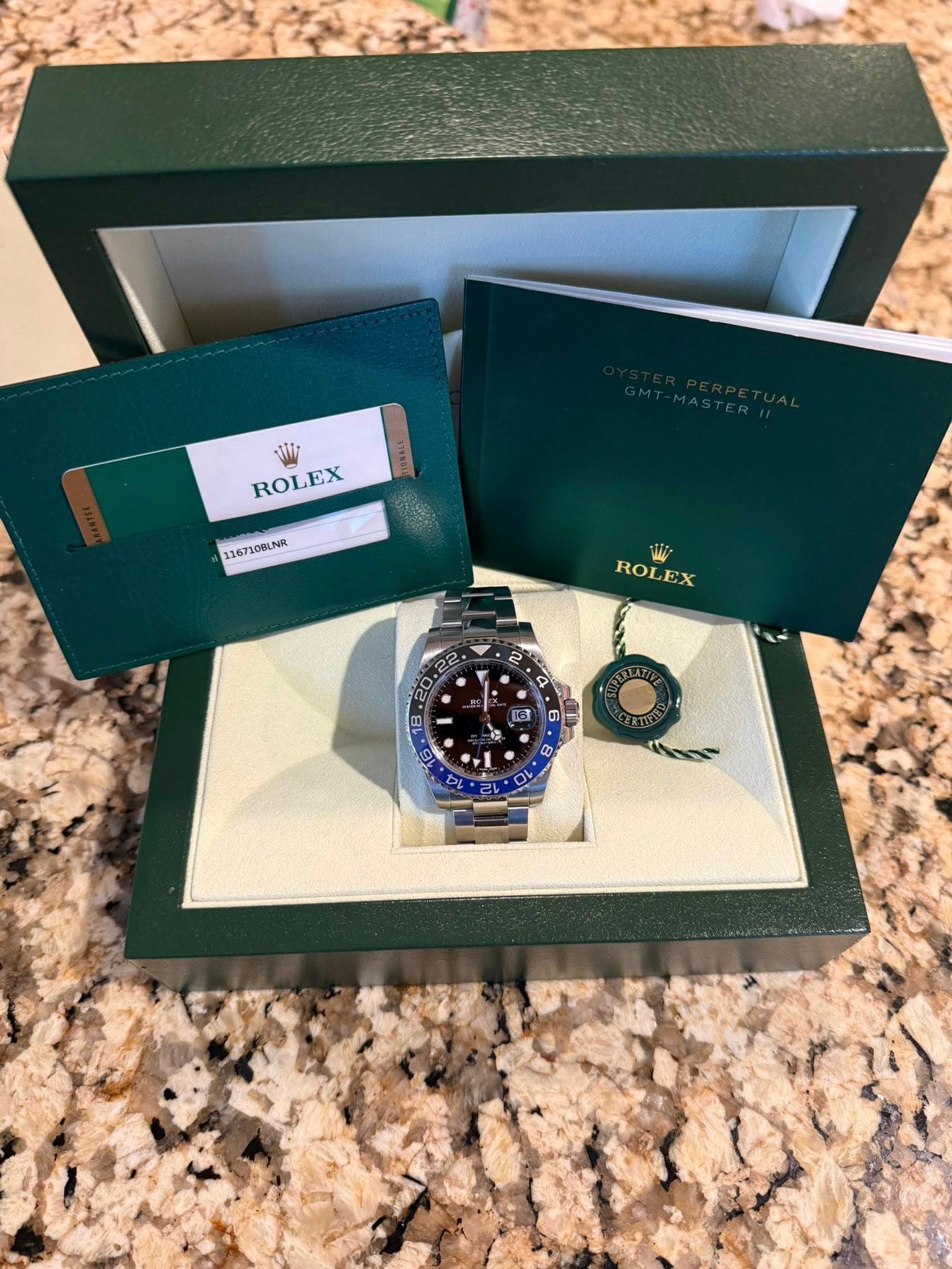 May be an image of wrist watch and text that says 'TALE ROLEX 116710BLNR WW ROLEX 2 22 20 • 00 - G 16 8 0 စ 0 2い 0'