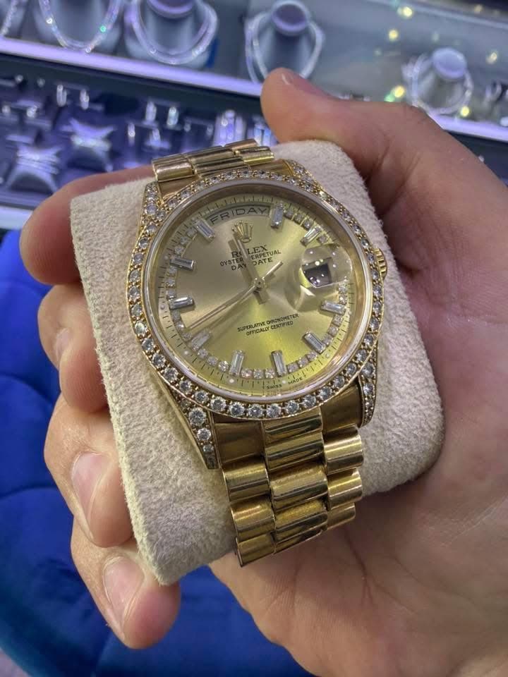 May be an image of wrist watch and text