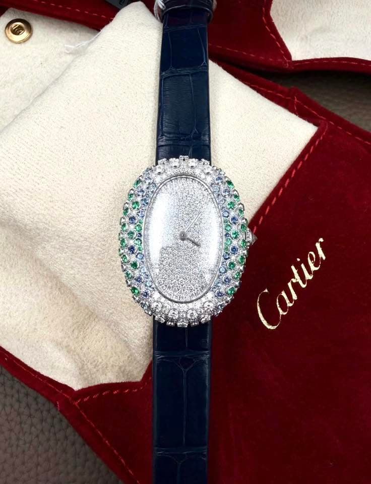 May be an image of wrist watch and text that says 'Cartier'