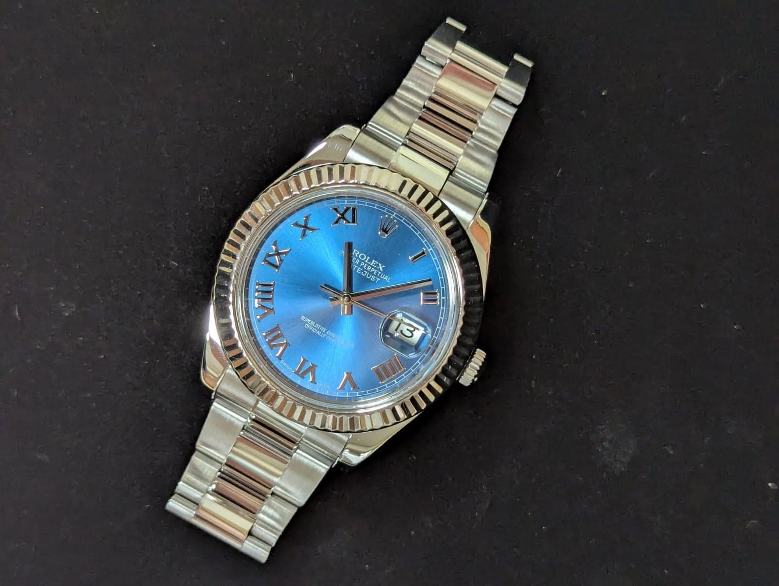 May be an image of wrist watch and text