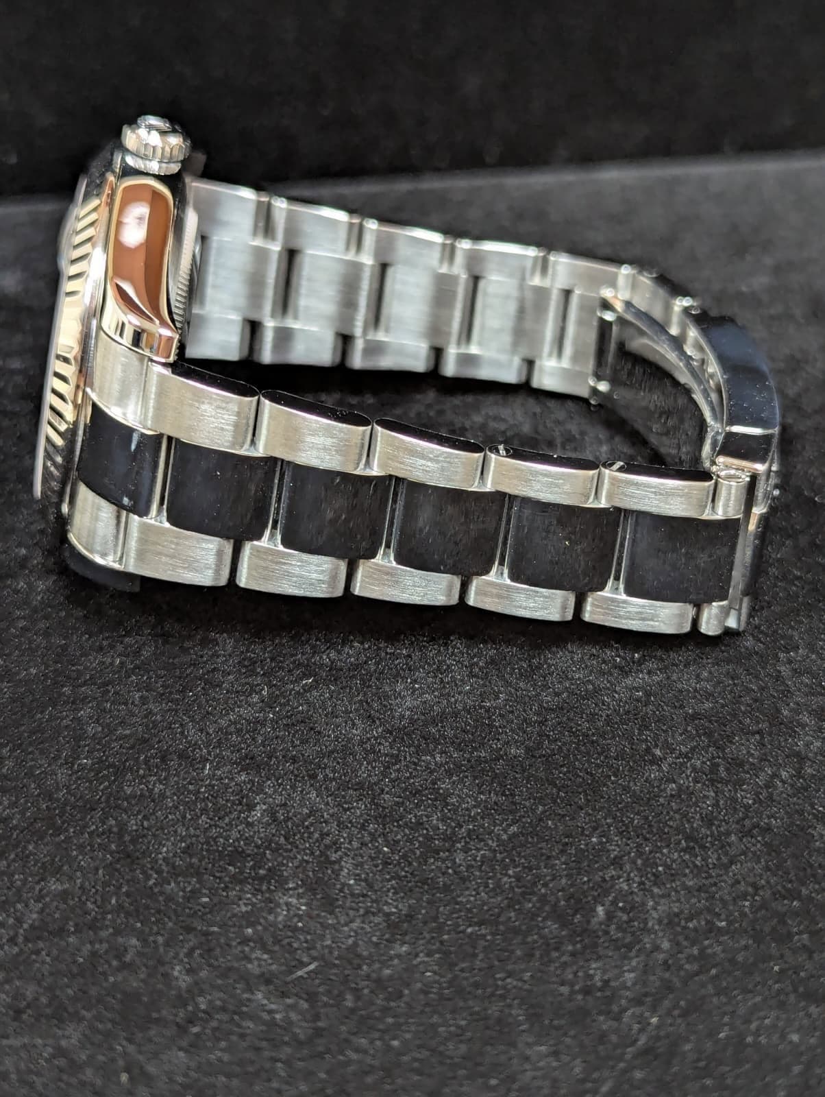May be an image of wrist watch and text