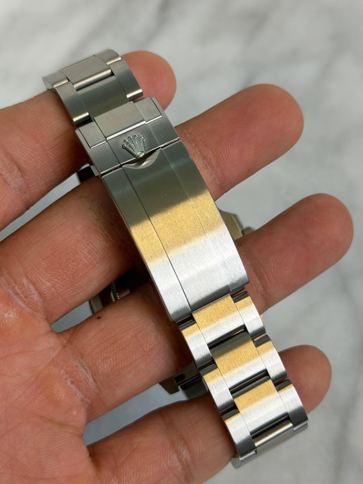 May be an image of wrist watch