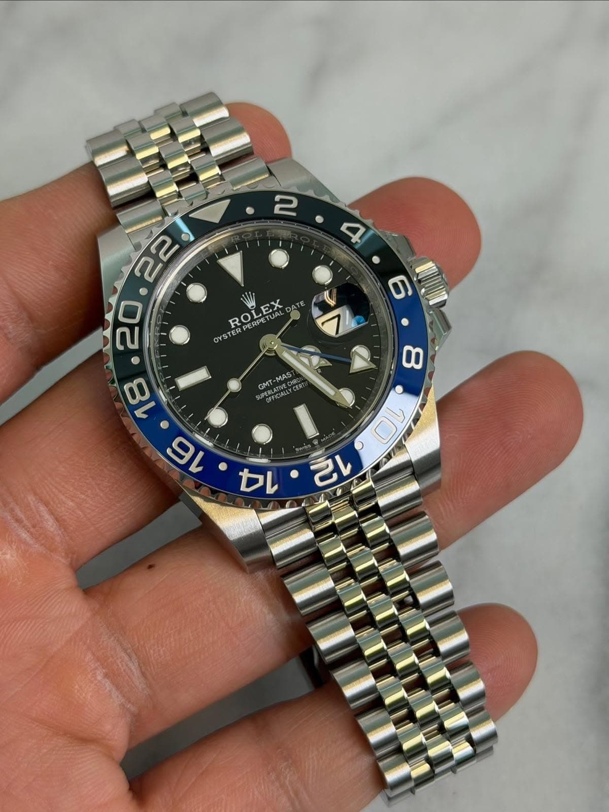May be an image of wrist watch and text