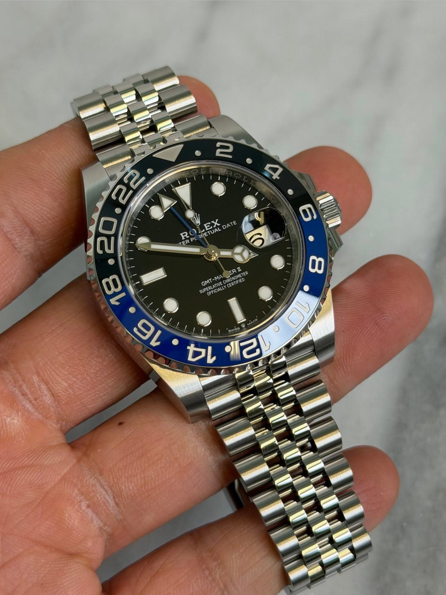 May be an image of wrist watch and text