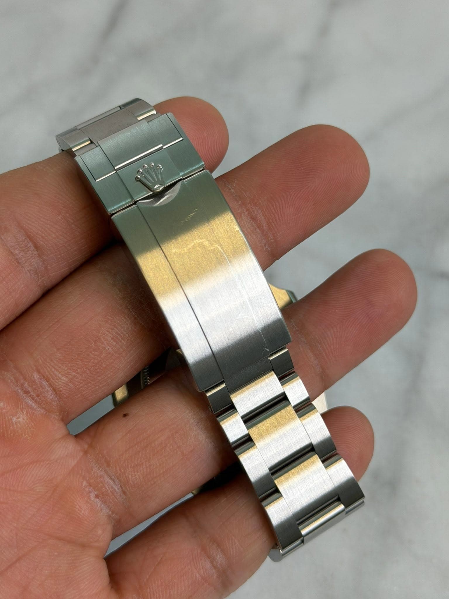 May be an image of wrist watch