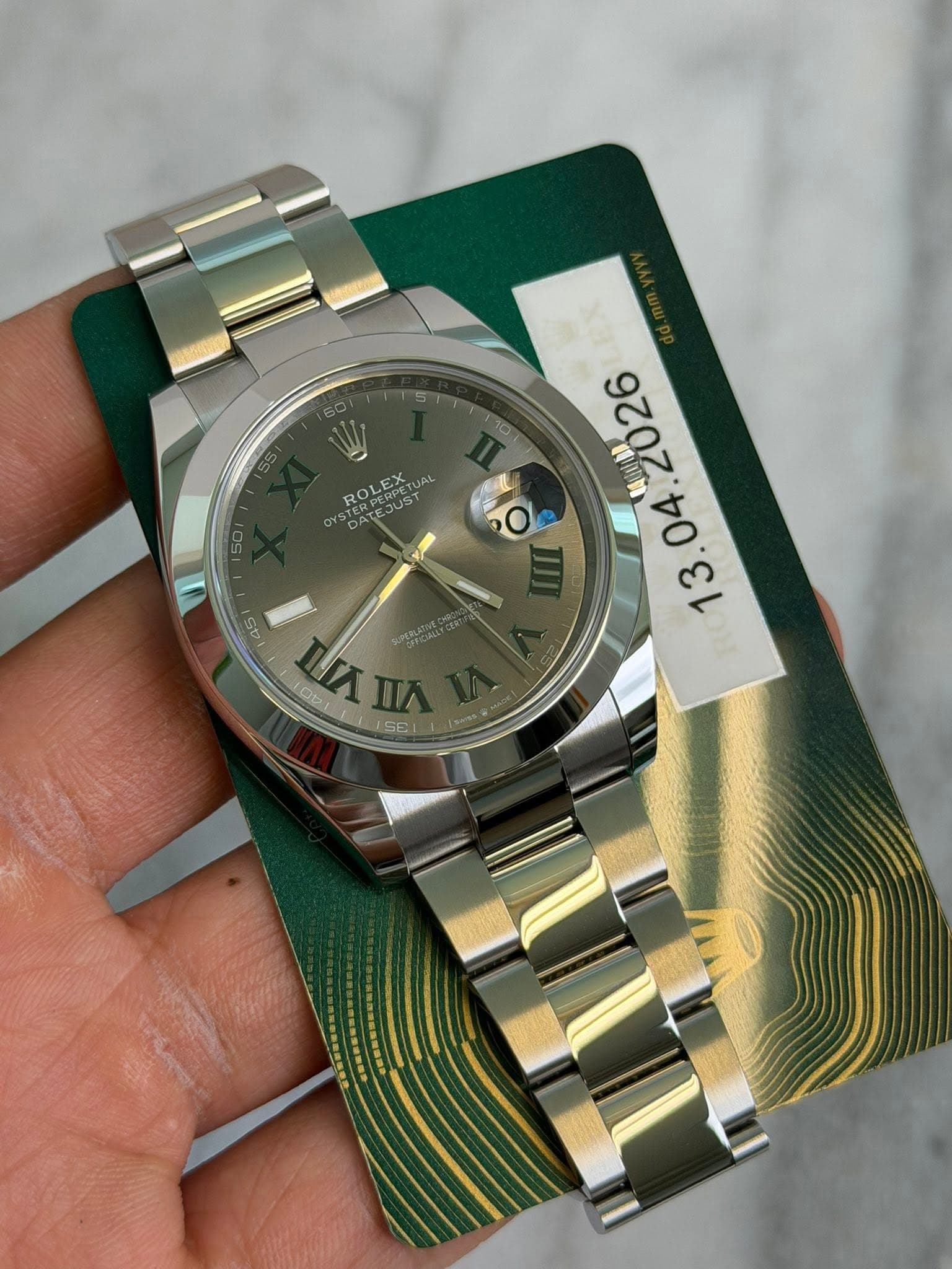 May be an image of wrist watch and text