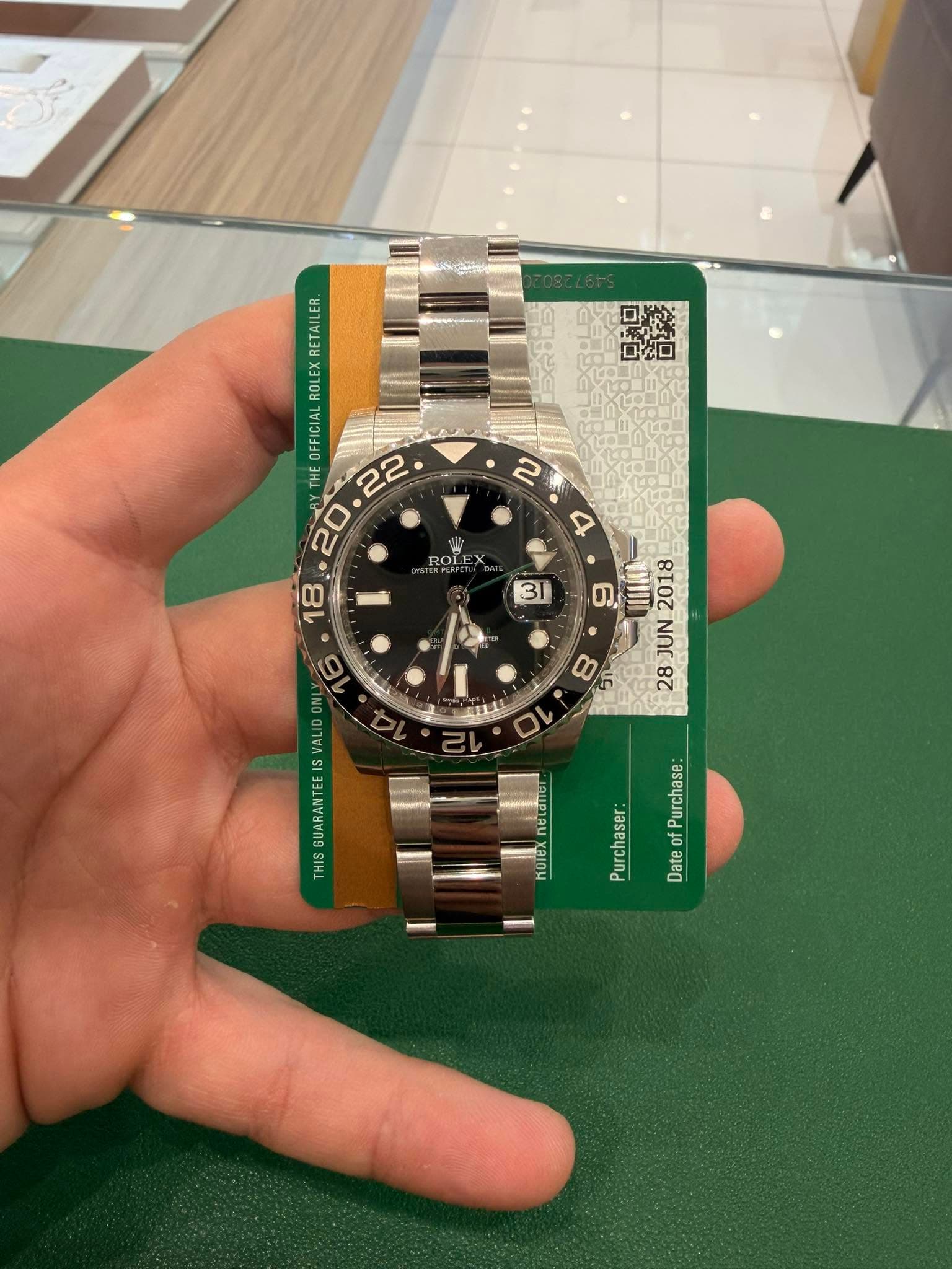 May be an image of wrist watch and text that says '口如口 2 4 ROLEX OLE TR CRMETES RETAILER. ROLEX ซเวเซ THE ON VALID IS OTE Νρι 2080 28 Purchase: of Date KOTX Purchaser:'
