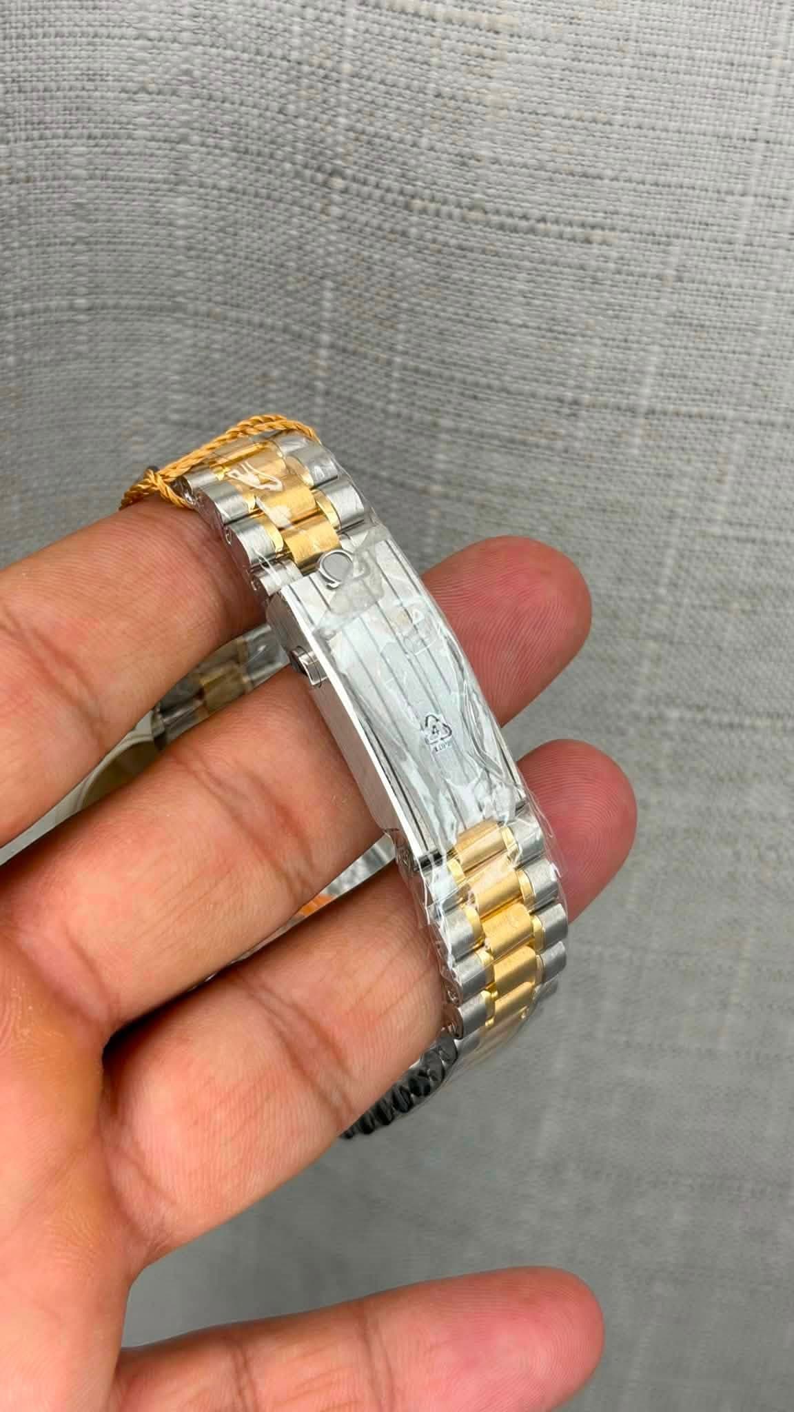 May be an image of jewelry and wrist watch