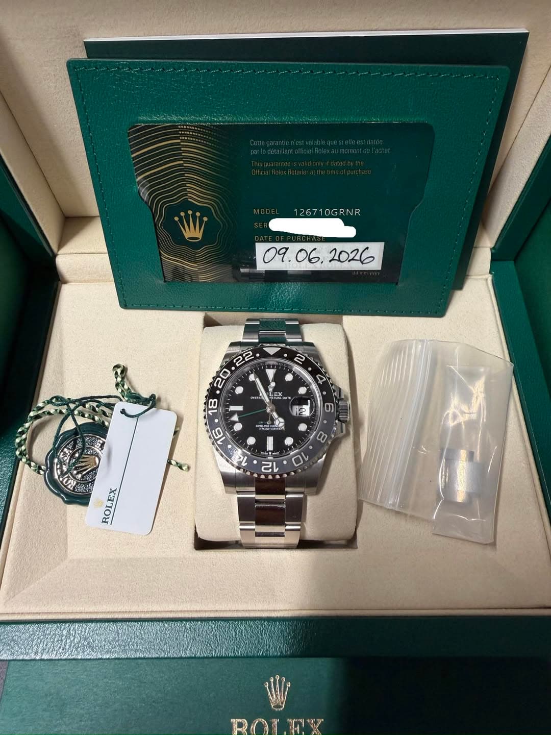May be an image of wrist watch and text that says '126710GRNR S یله / ROLEX LEX EX ROL'