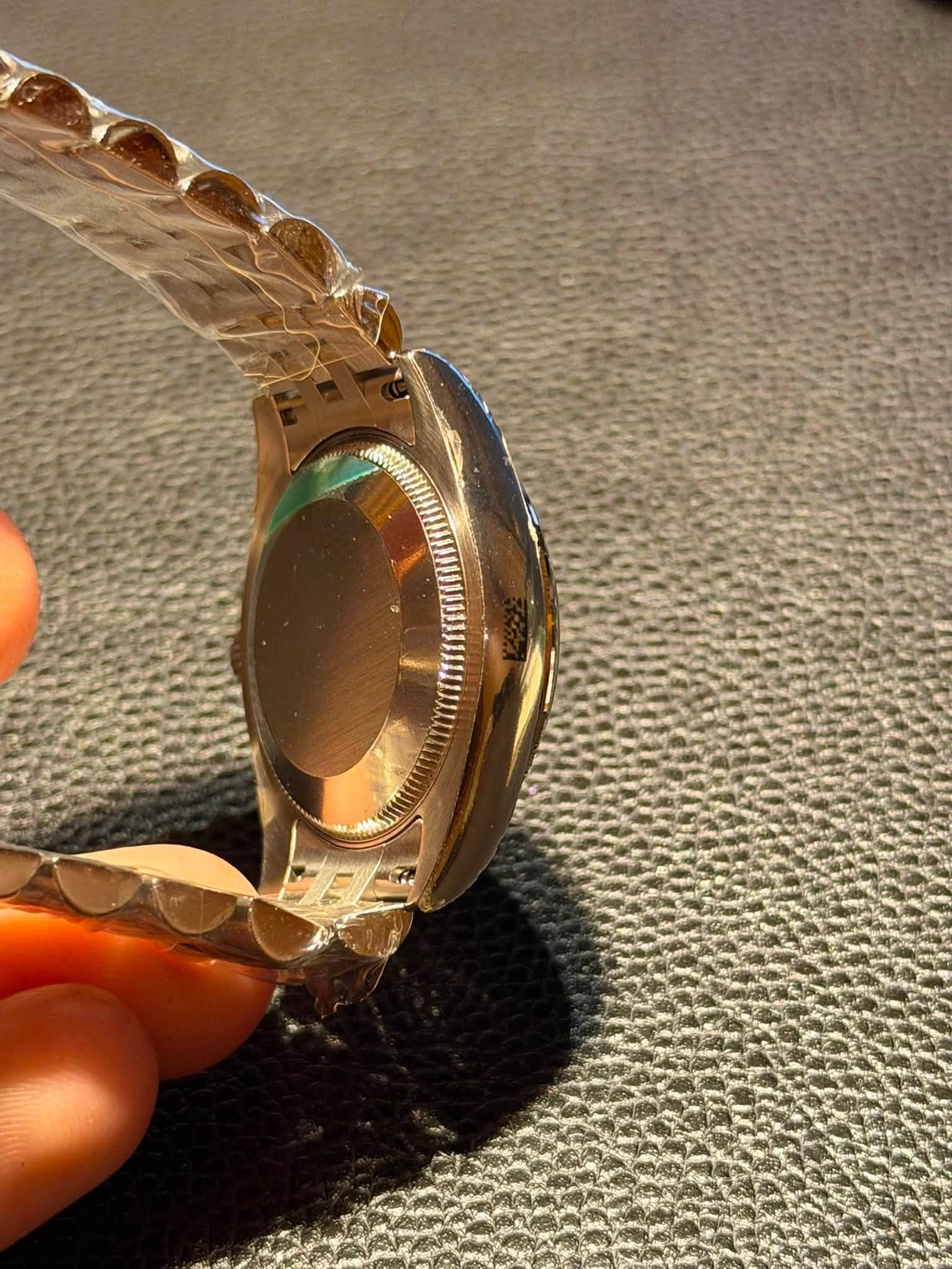 May be an image of wrist watch and ring