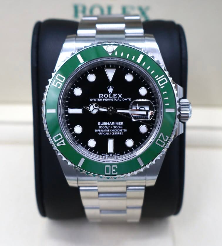 May be an image of wrist watch and text that says 'ROL 50 ROLEX OYSTE ER PERF PERPET OYSTERPERPETUALDATI PE UA DATE 10 SUBMARINER S/P0TER K 1000/ 1300m ER 300 SUPERLATIVE HRONOME…