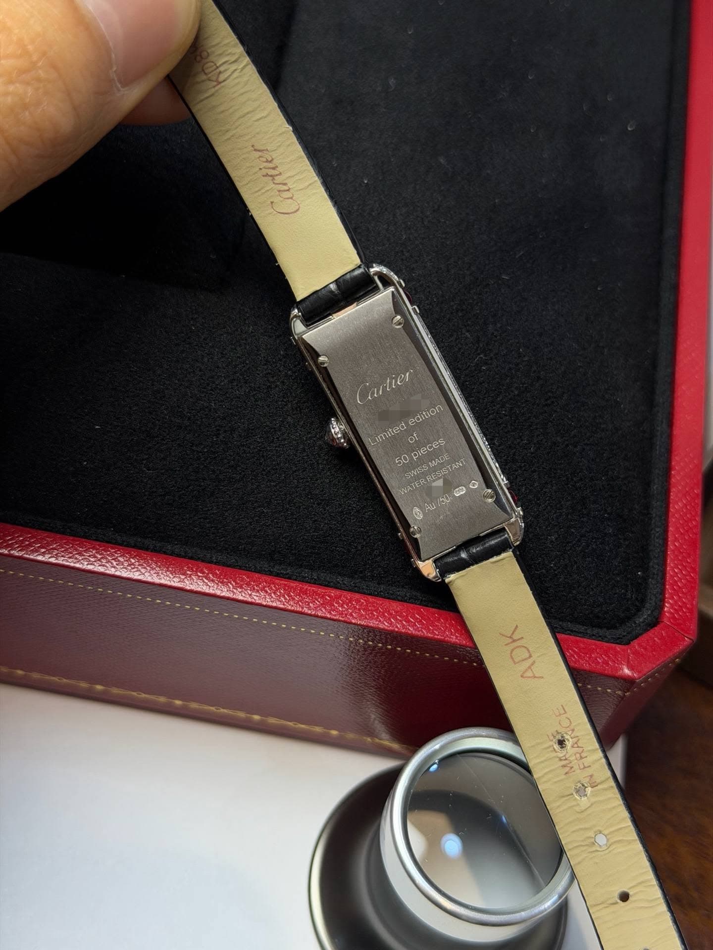 May be an image of wrist watch, saddle-stitched leather, measuring stick and text