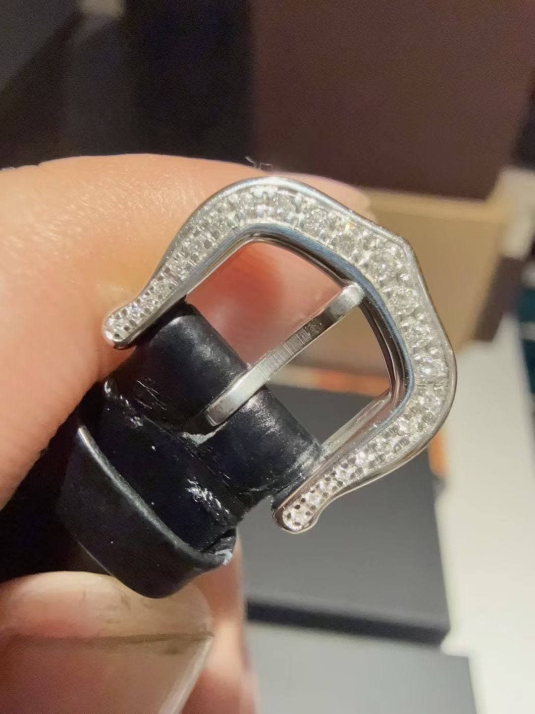 May be an image of wrist watch and ring