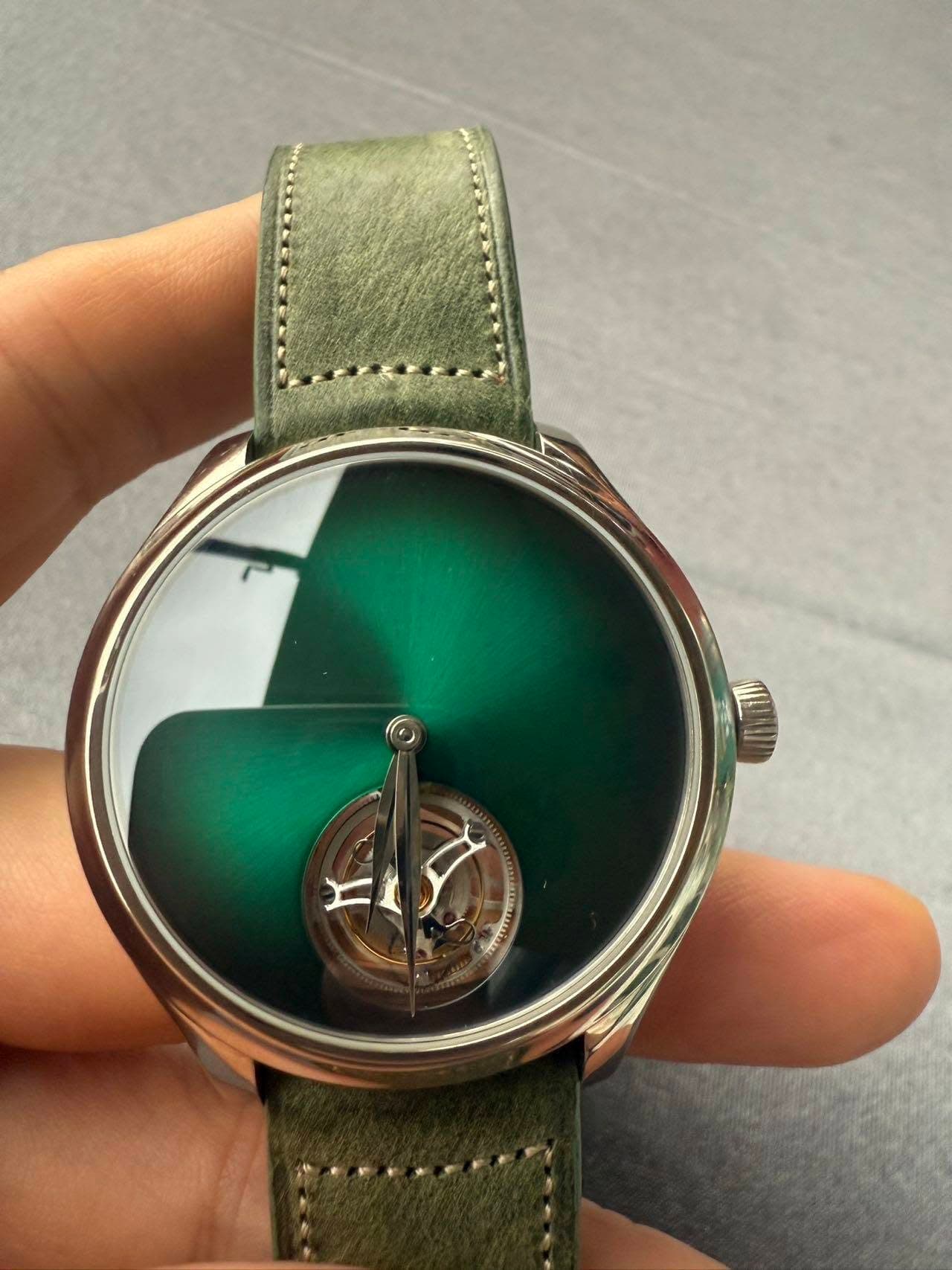 May be an image of wrist watch and text