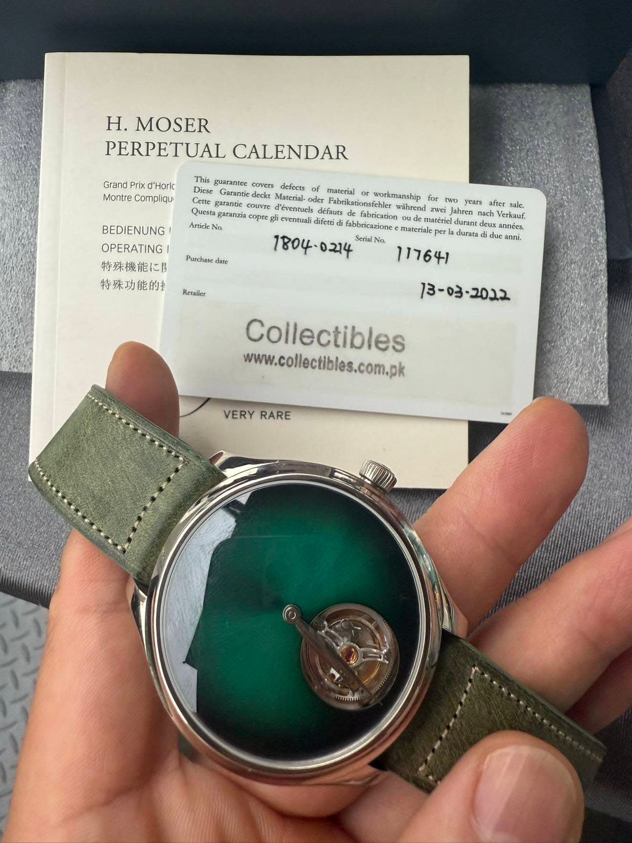 May be an image of wrist watch and text that says 'H. MOSER PERPETUAL CALENDAR Grand Prix d'Horic Montre Compliqu This guaranter cuvers dieferts Diese Material- gafantie couVrE…