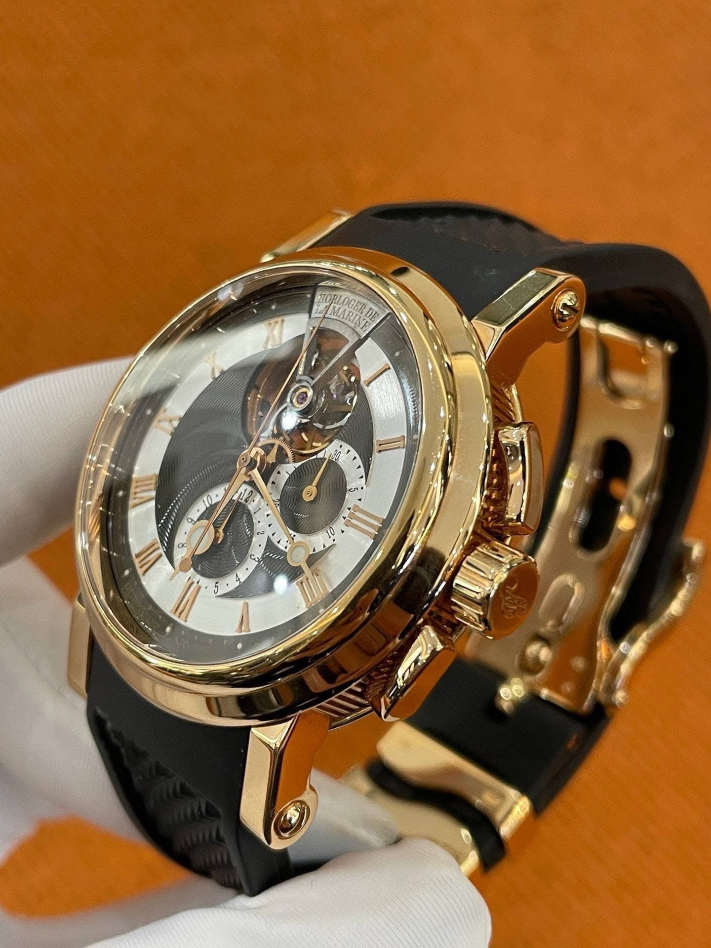 May be an image of wrist watch and text