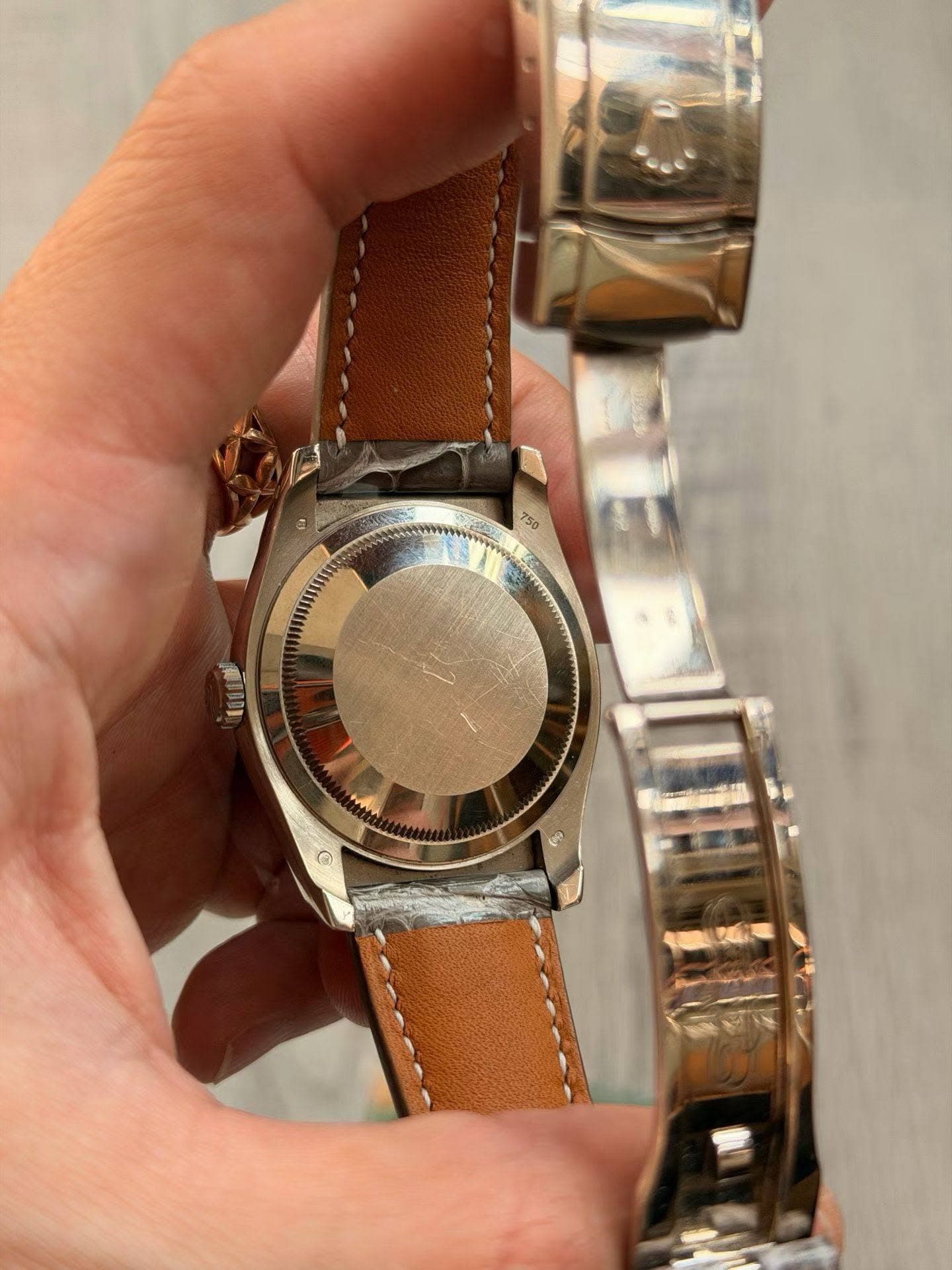 May be an image of wrist watch and text