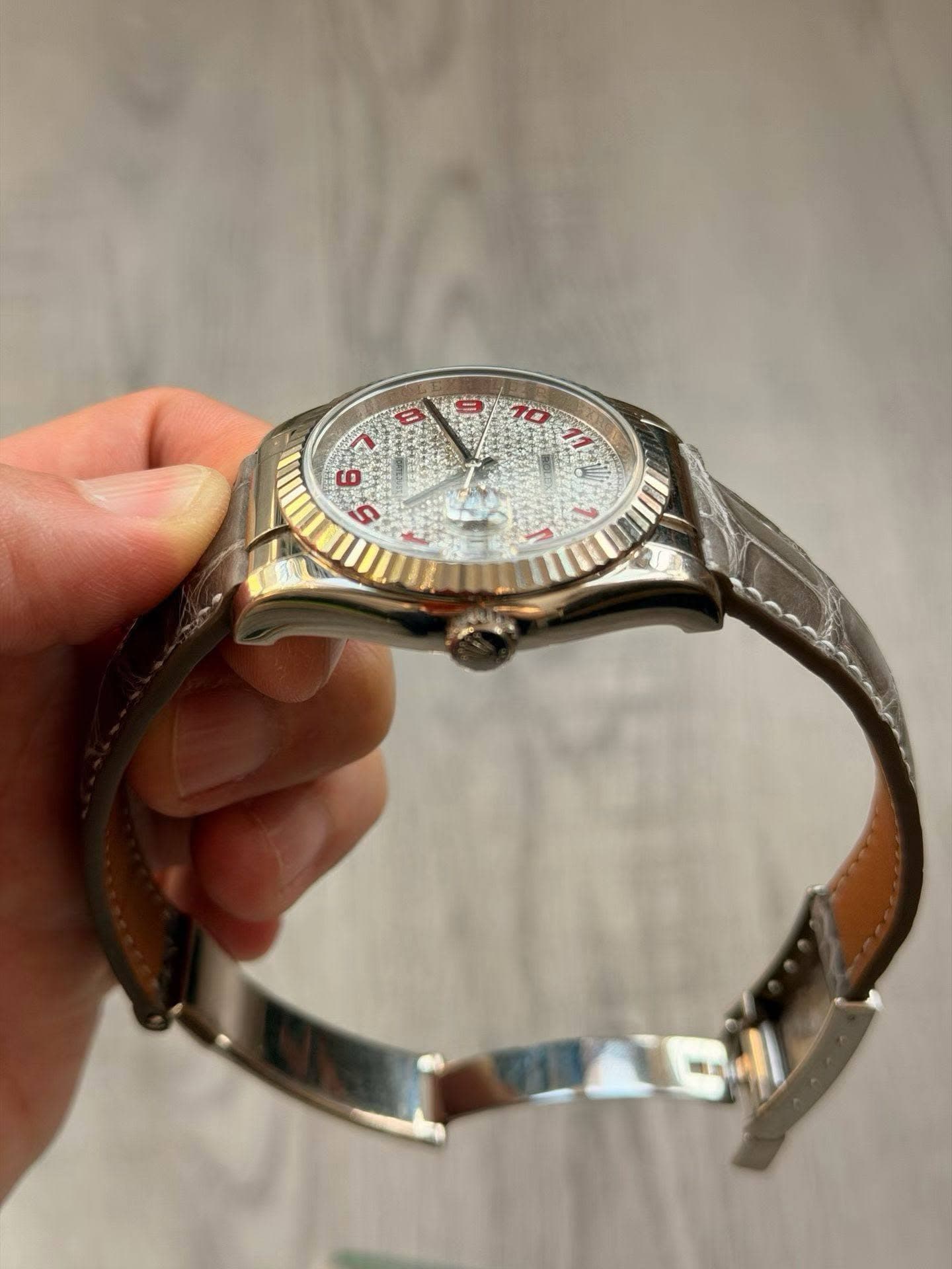 May be an image of wrist watch and text