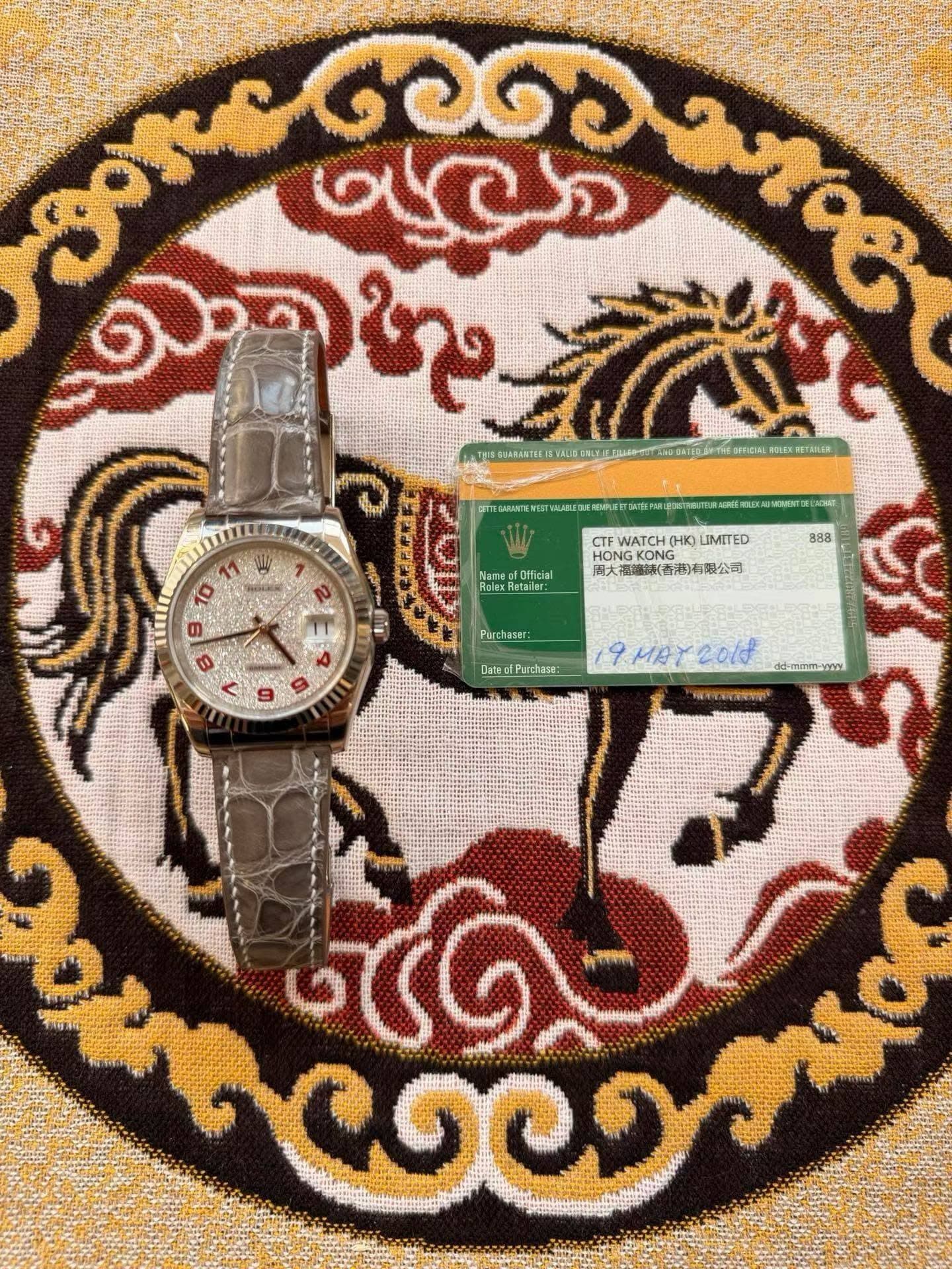 May be an image of wrist watch and text