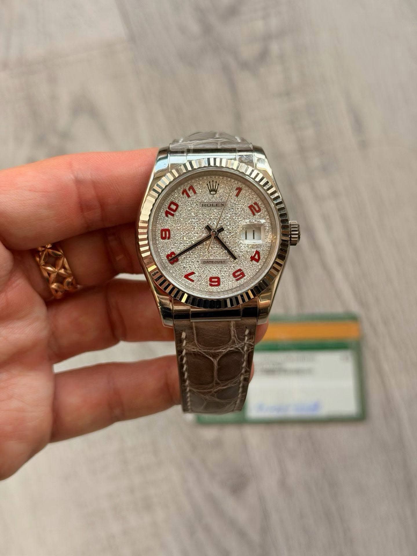 May be an image of wrist watch and text