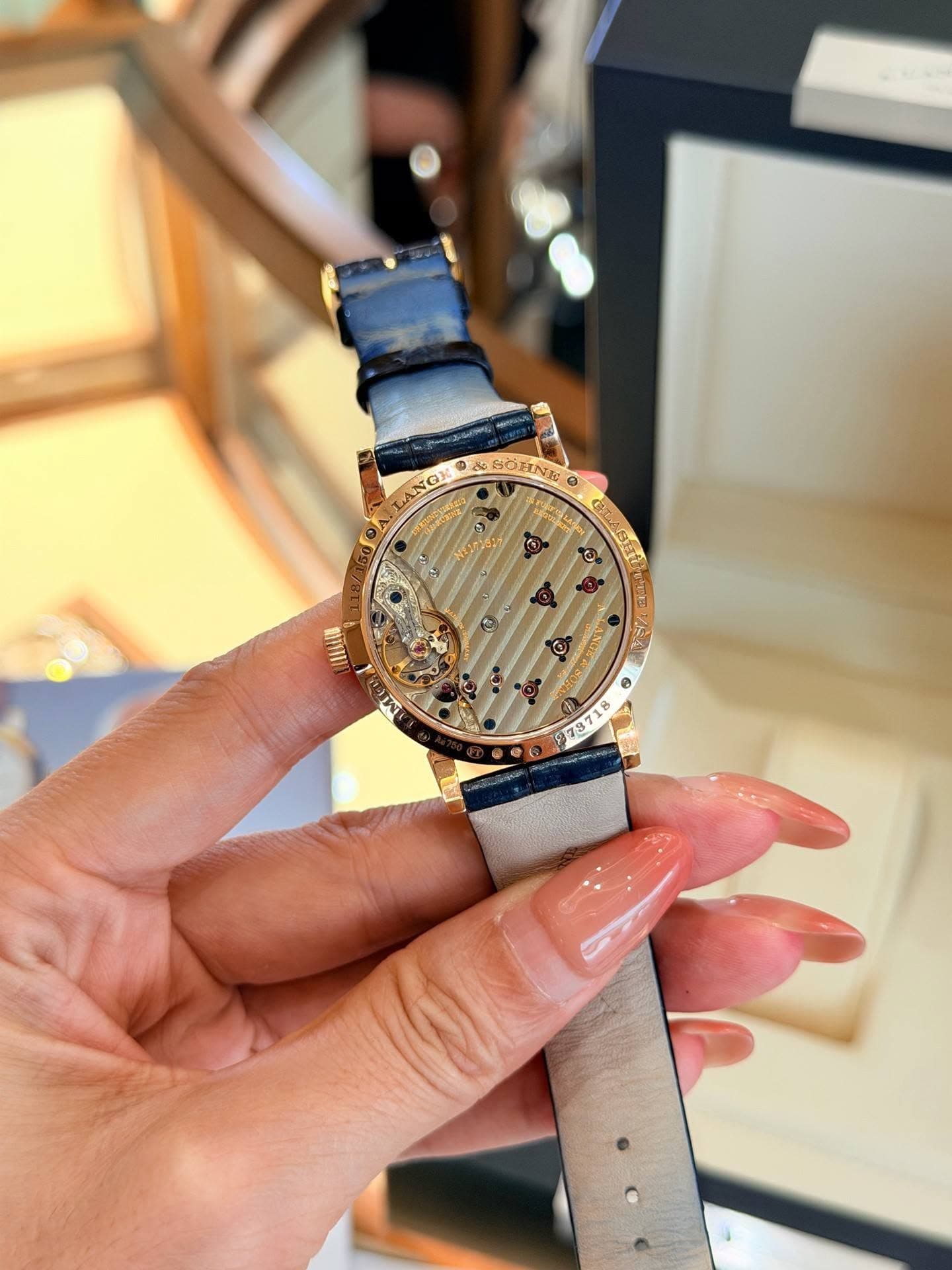 May be an image of wrist watch and text
