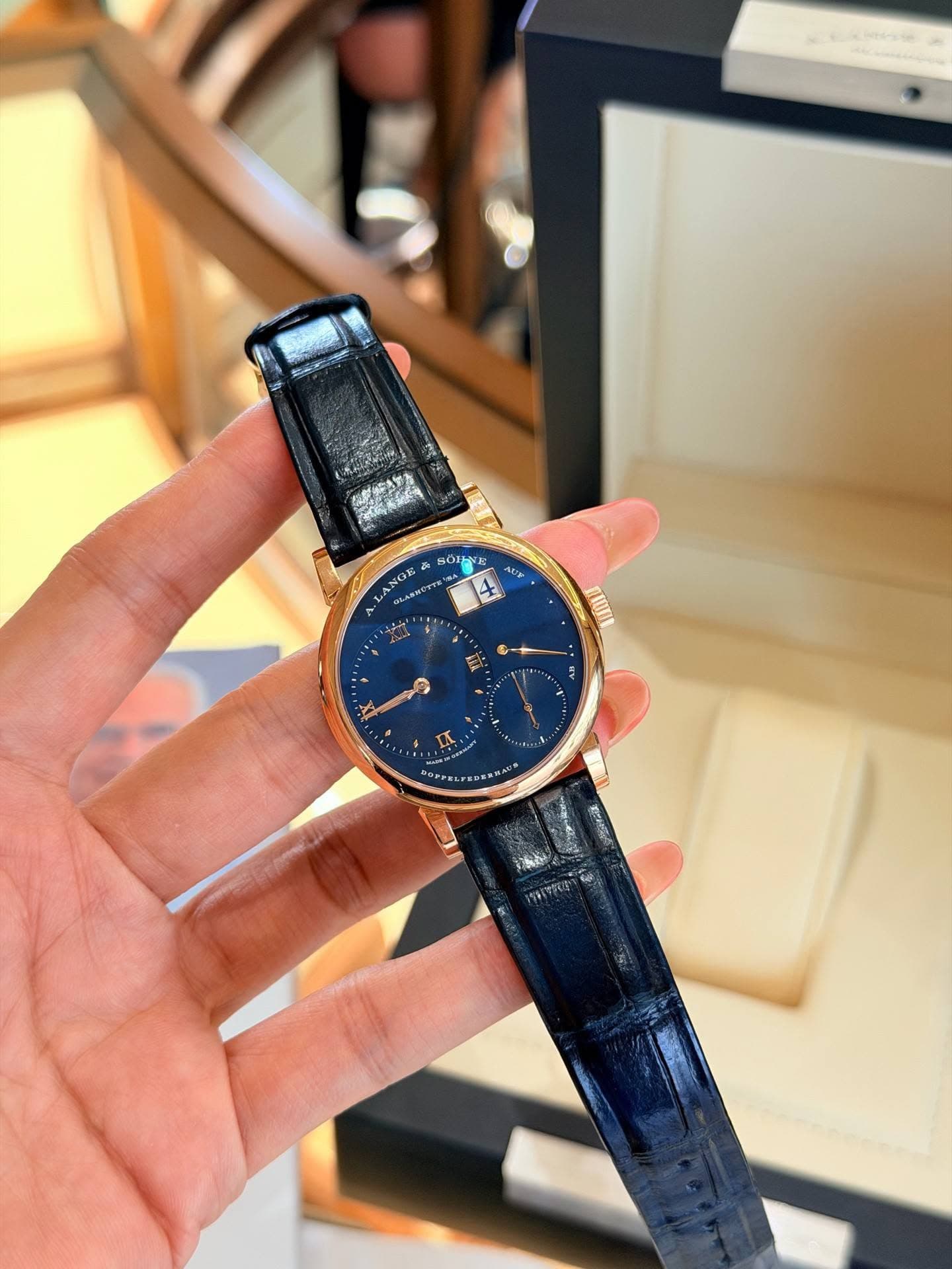 May be an image of wrist watch and text