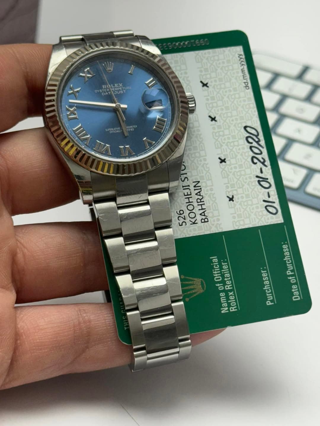 May be an image of wrist watch and text that says 'o ROLEX STERTOUST /11I II ΚΑΛλ Kελ'Ww.pP sTu. 526 KOOHEJI BAHRAIN - Purchase Purchaser of Date Official RolexRetailer: Rolex of…