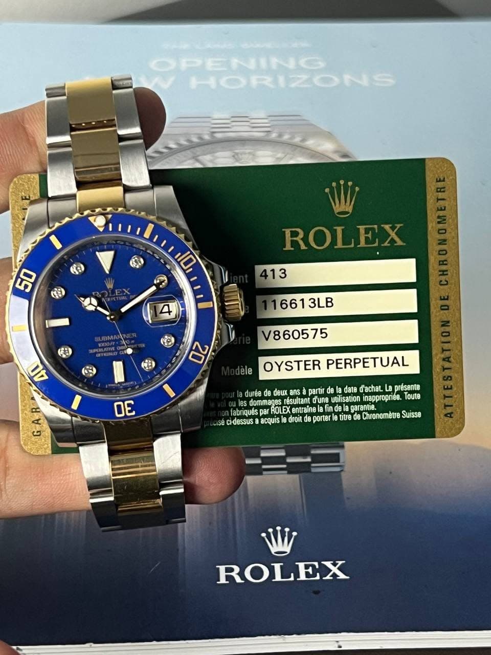 May be an image of wrist watch and text that says '်ပတ်ခ်ခ OPENING HORIZONS ៥ 50 の K9 10 S ROLEX 413 4 16613LB 南) V860575 20 ele OYSTER PERPETUAL 30 GAB durée deux partr d'achat.…