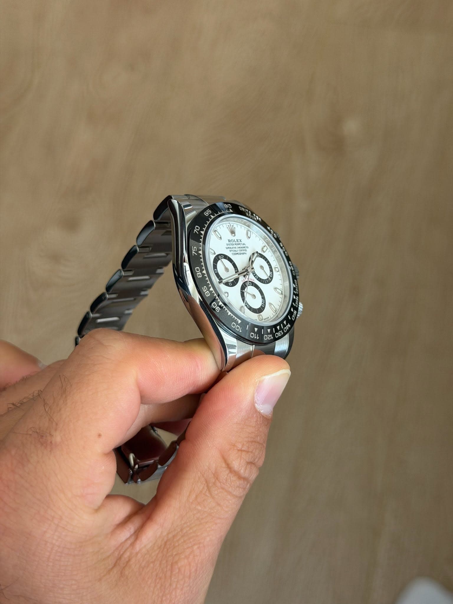 May be an image of wrist watch and text