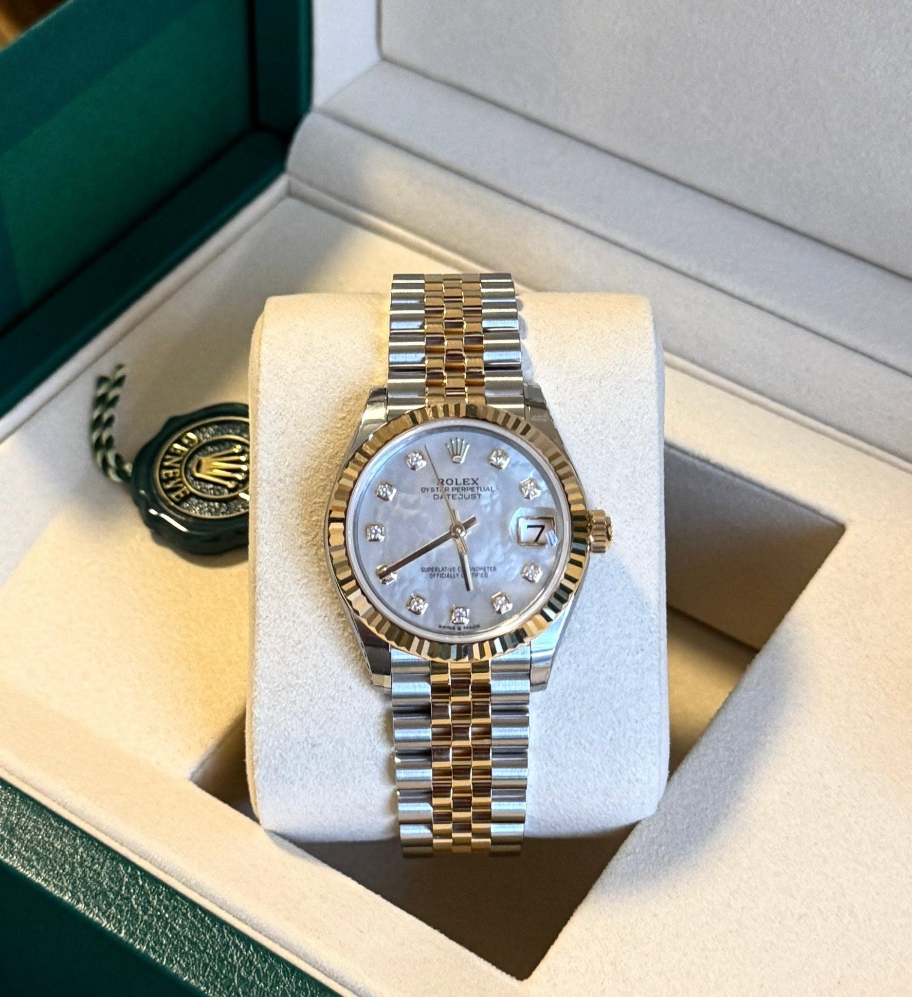 May be an image of wrist watch and text