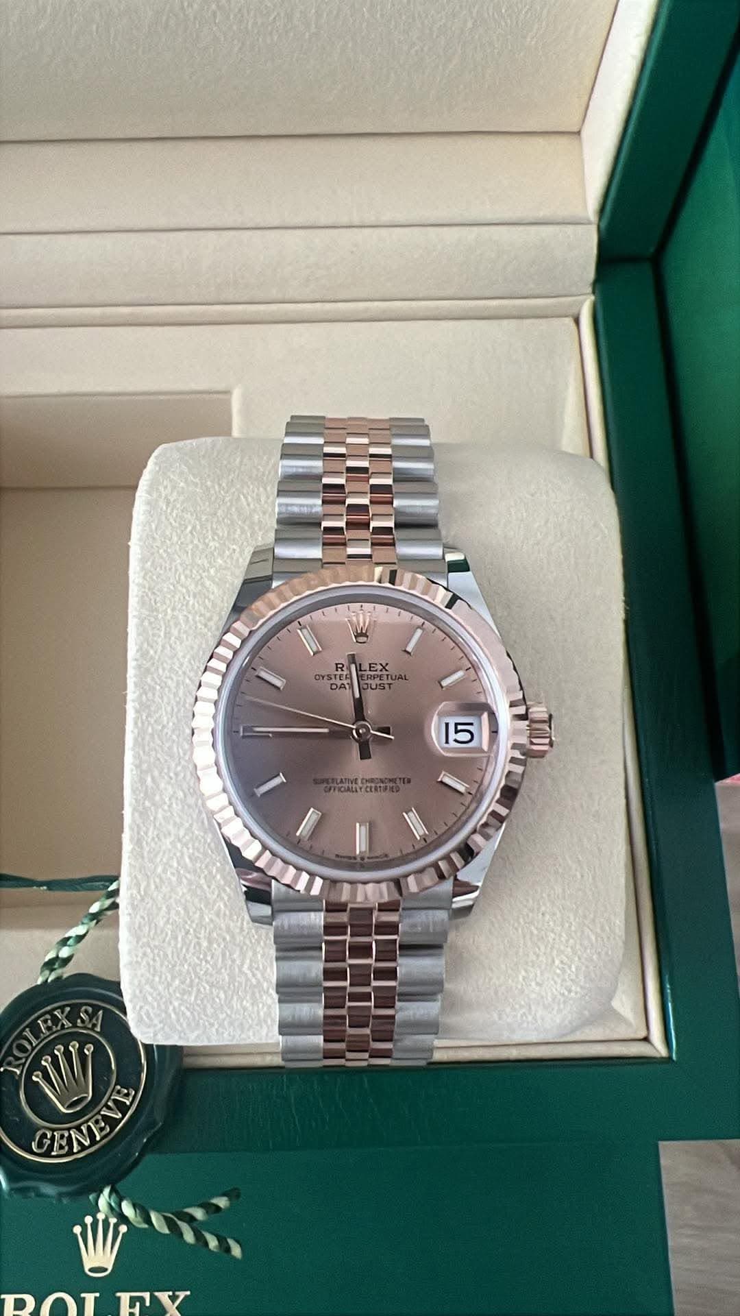 May be an image of wrist watch and text