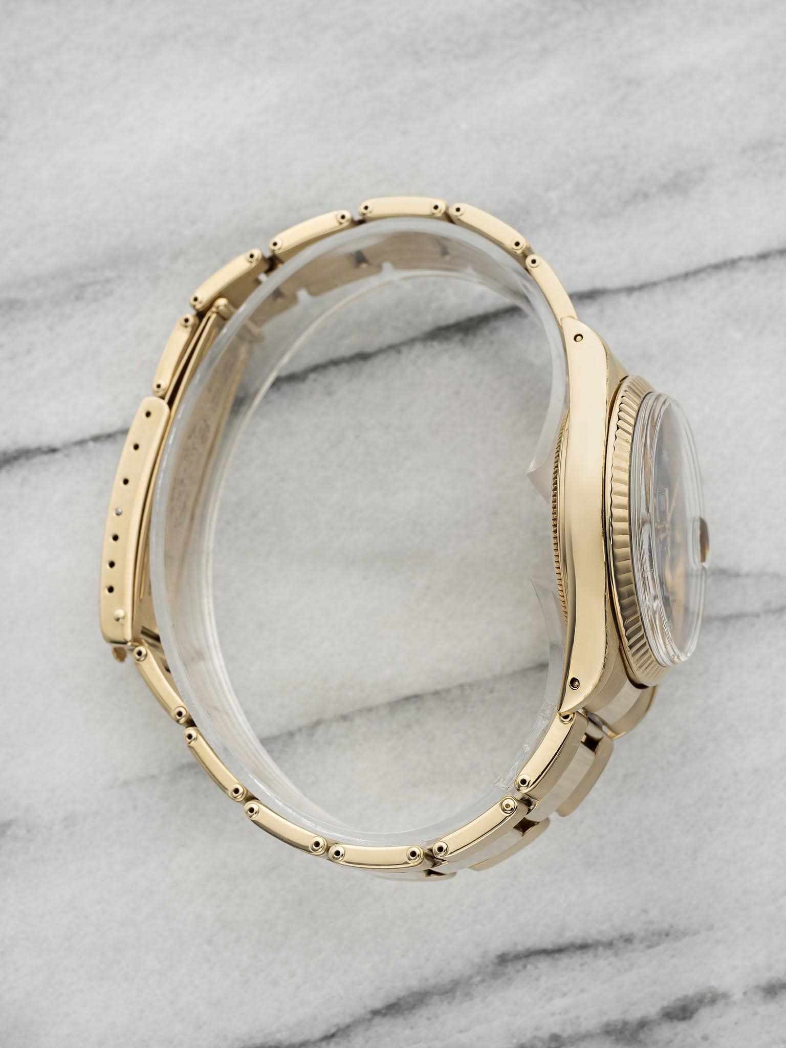 May be an image of jewelry and wrist watch