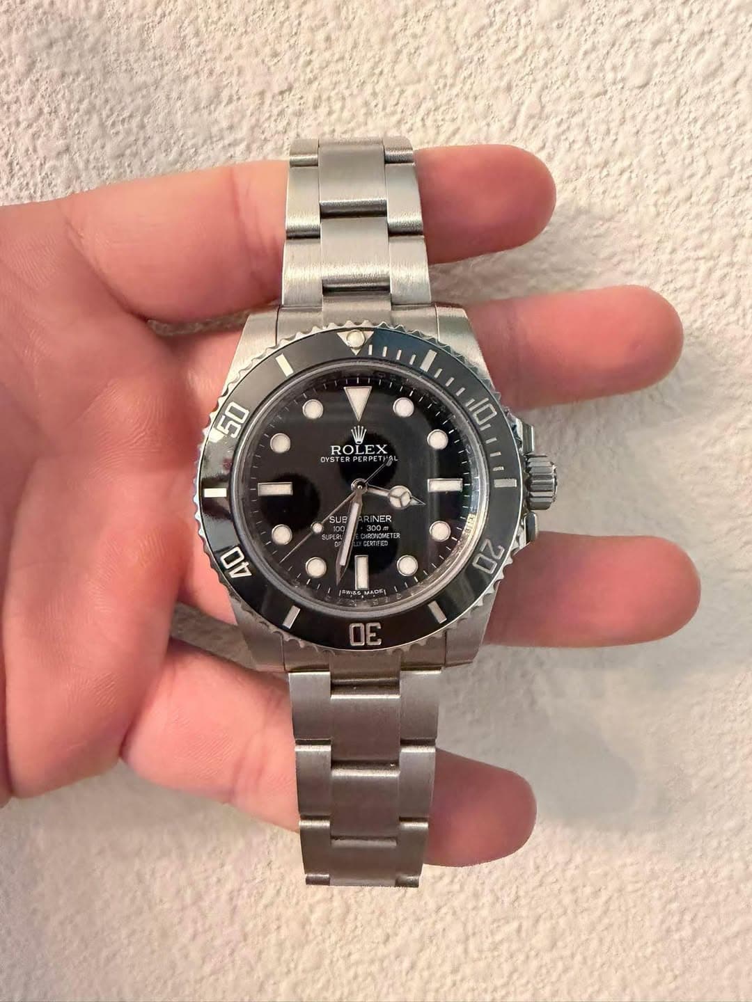 May be an image of wrist watch and text