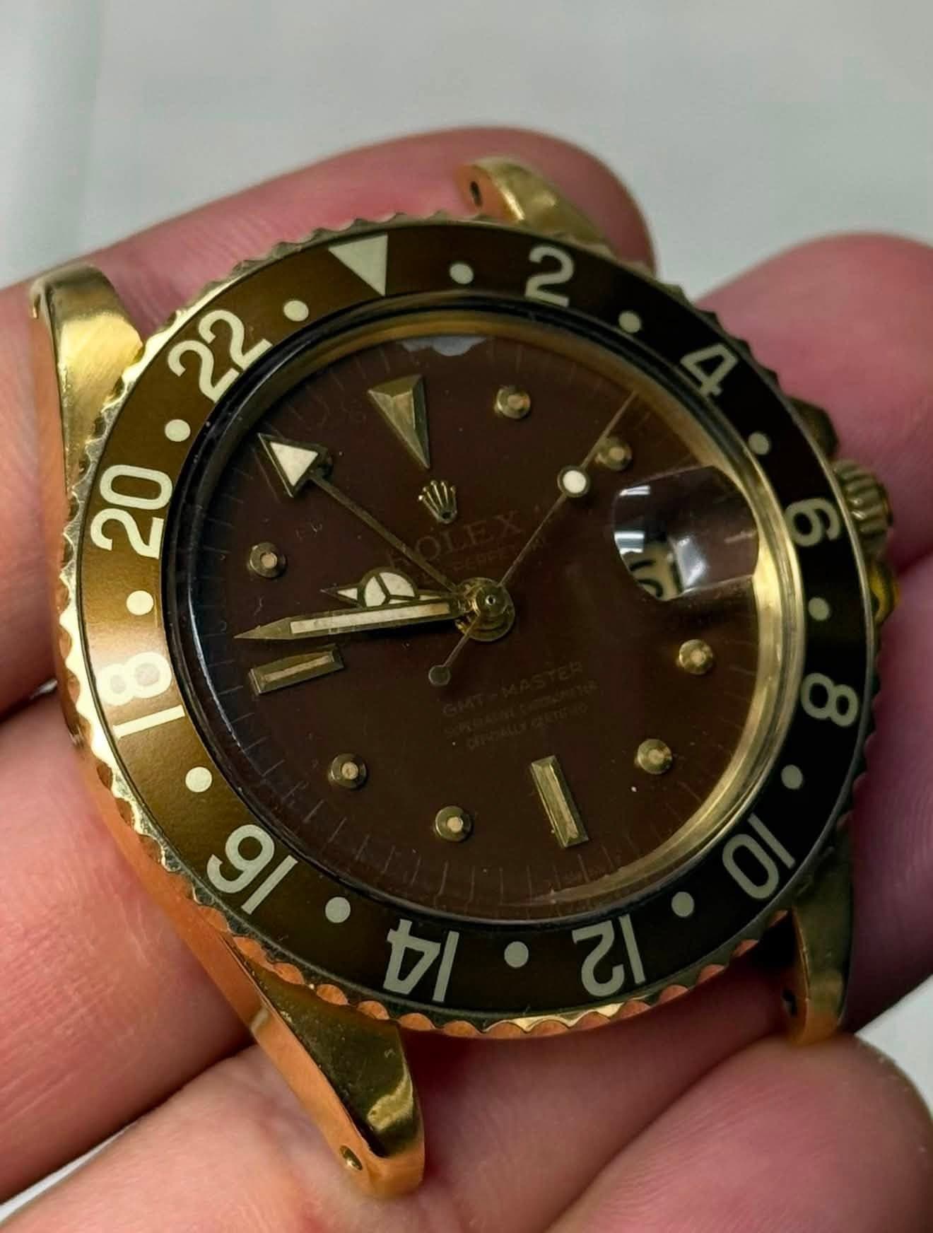 May be an image of wrist watch and text