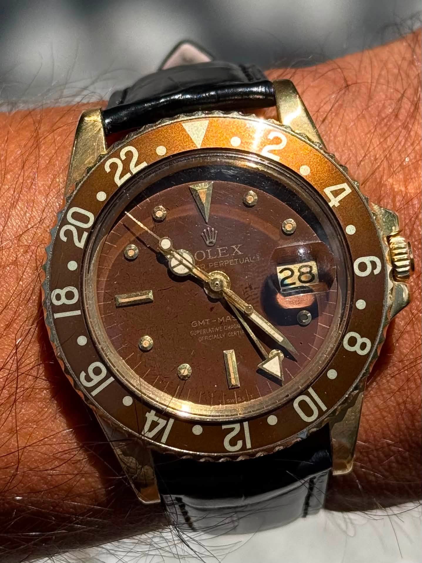 May be an image of wrist watch and text