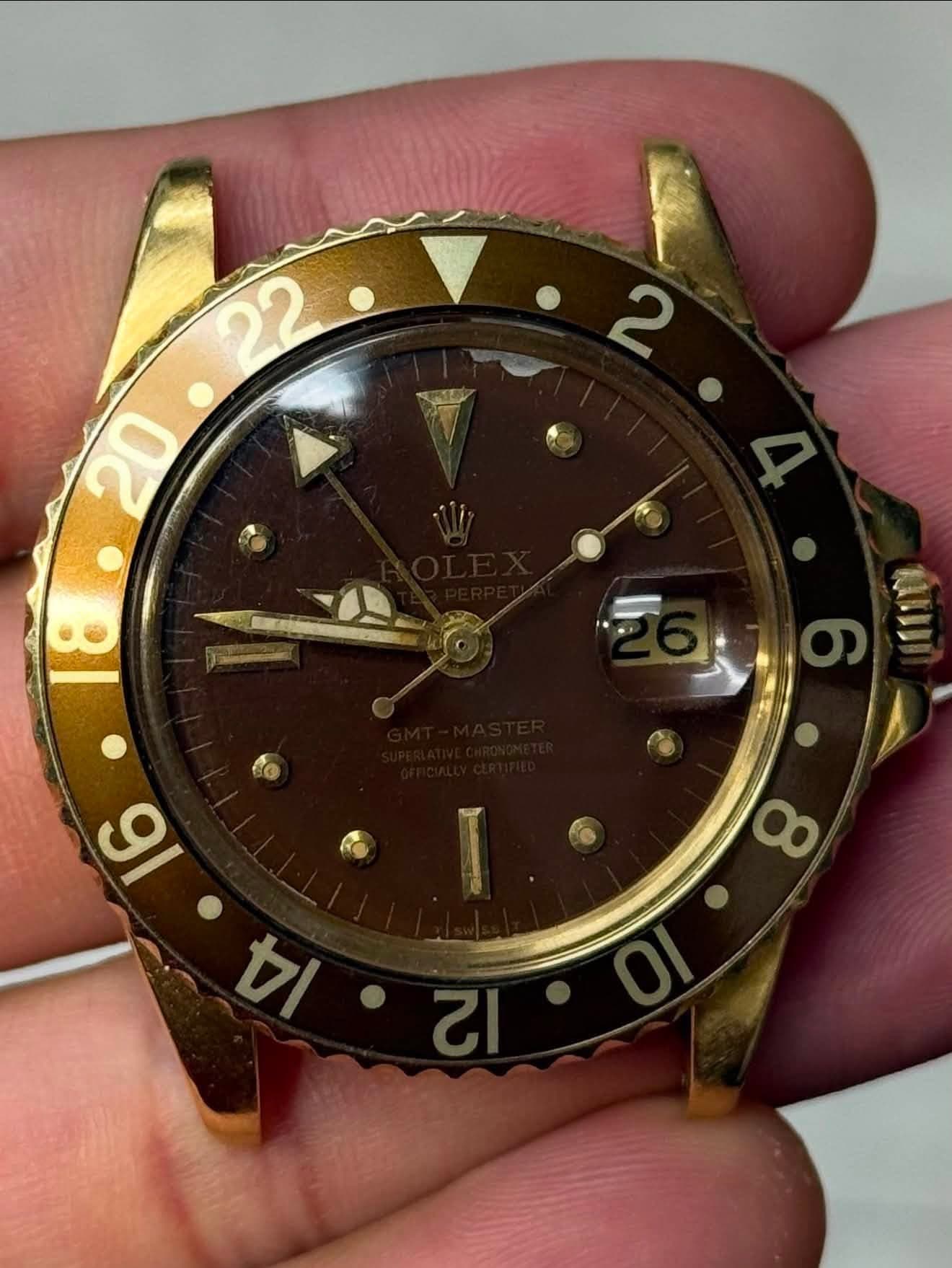 May be an image of wrist watch and text that says ' ול ထ'