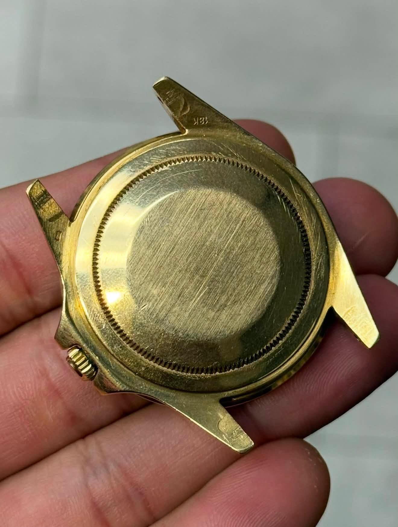 May be an image of brass and wrist watch
