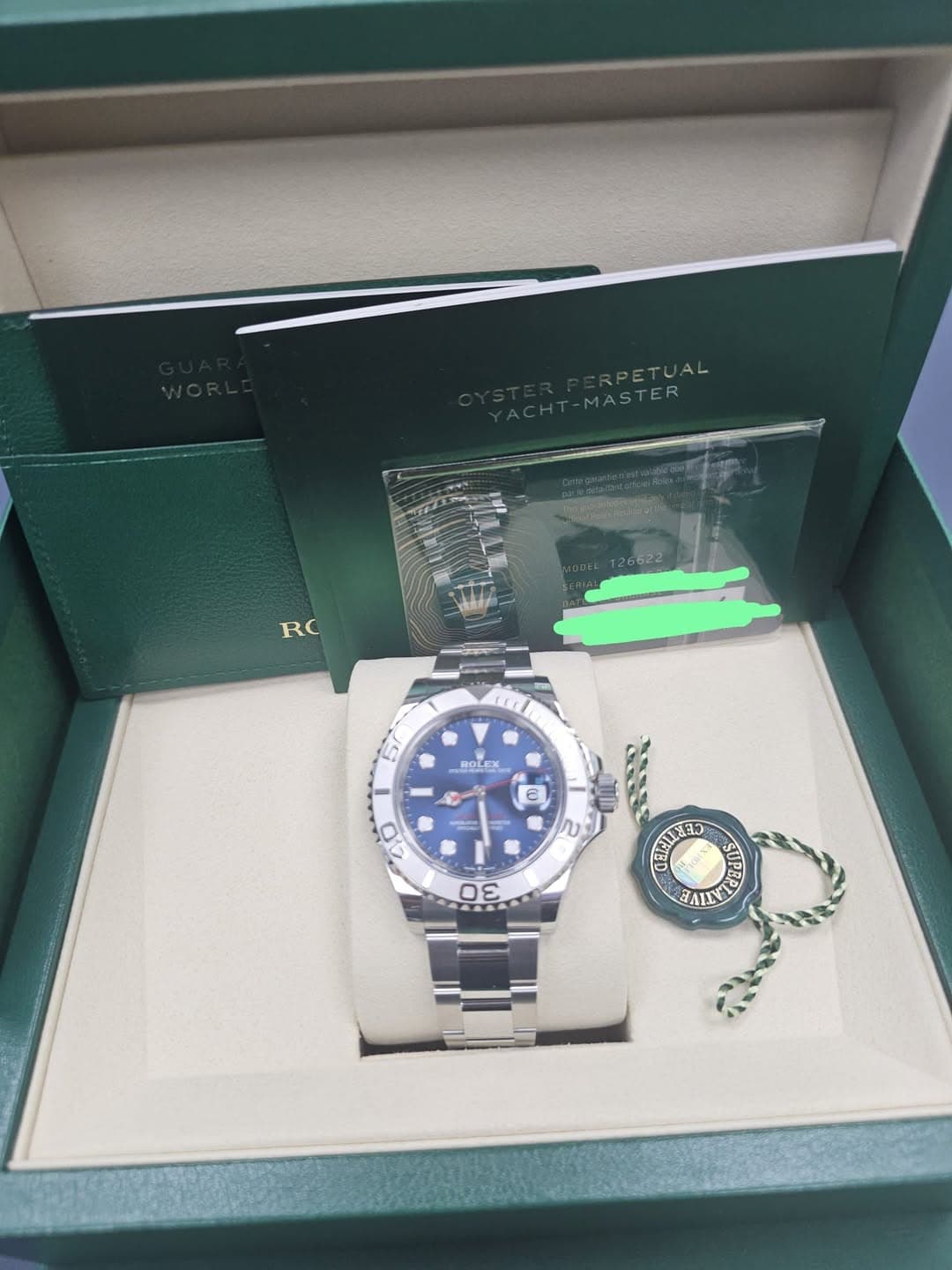 May be an image of wrist watch and text that says 'RPETUAL ETUAL MASTER RC 57 ROLEX H e) ודה 2 SE 03 FALNA'