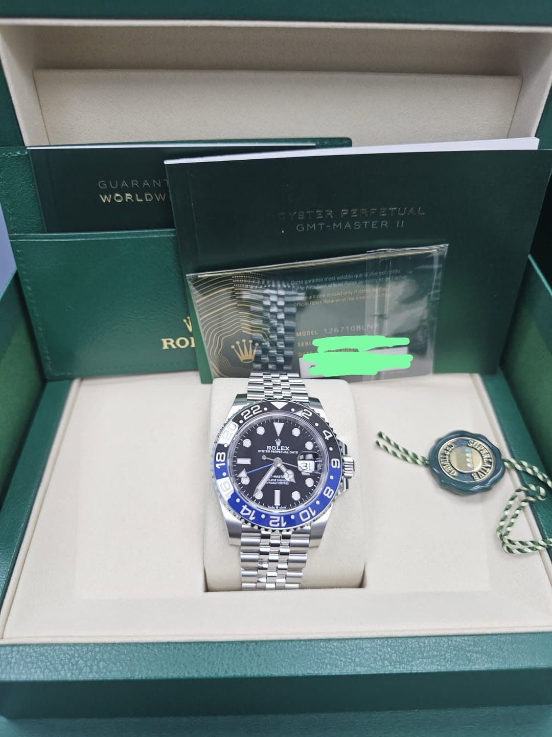 May be an image of wrist watch and text that says 'WORLD ROI MODEL 126710BINH W- 22 4 ROLEX.. 18 GTAC 5 6 6 E 8 80 14 T 10 12 AN'