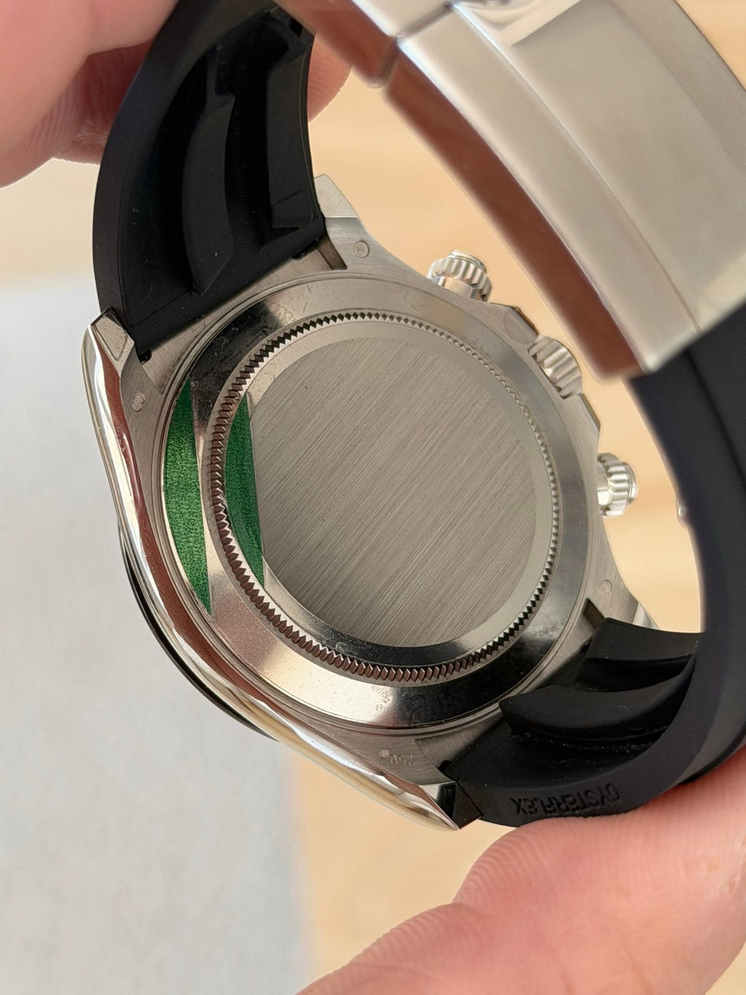 May be an image of wrist watch and text
