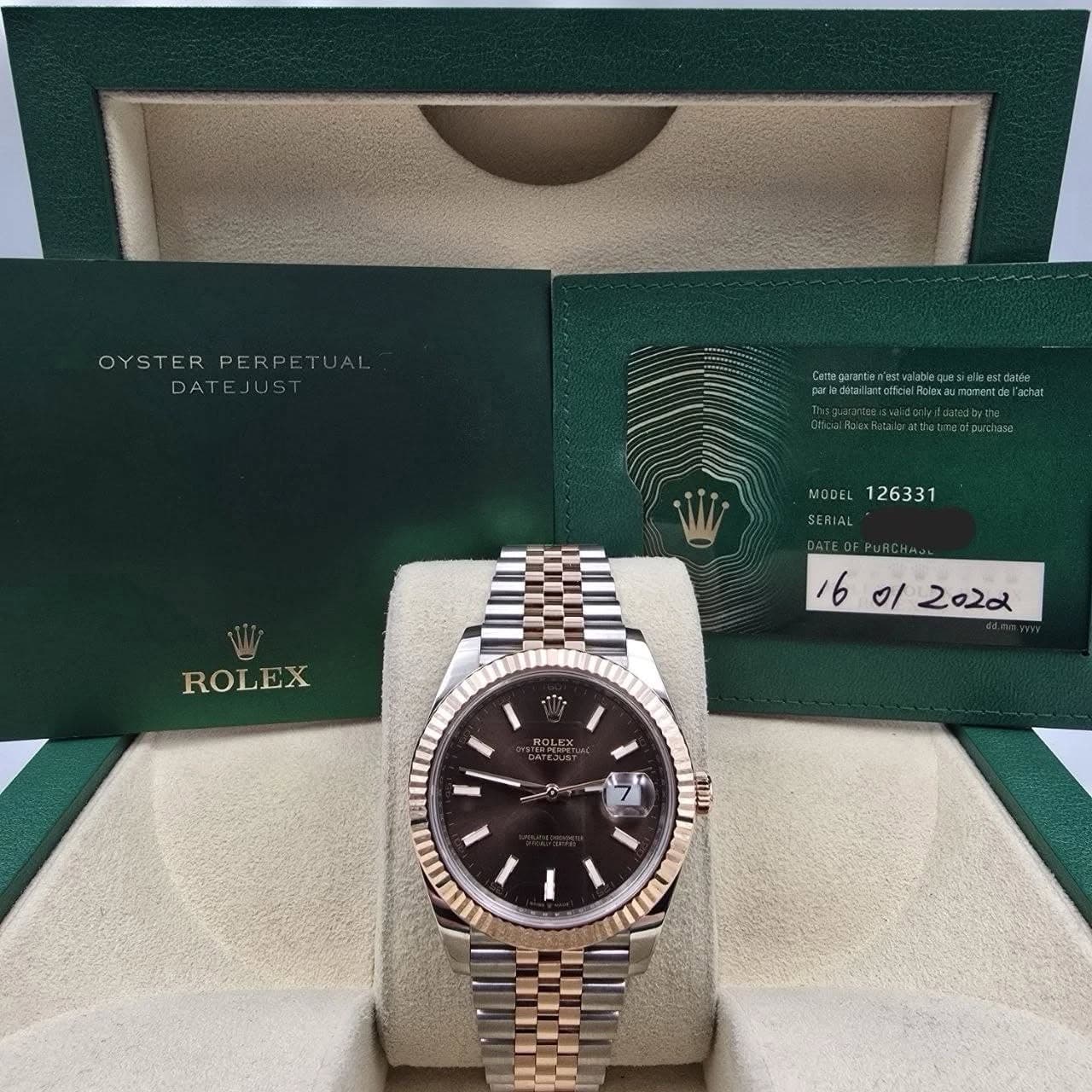 May be an image of wrist watch and text that says 'OYSTERPERPETUA! PERPETU OYSTERPE ER DATEJUS DATE_ CenapaTa pebdrna/arceficioeume MOJEL126331 MODEL 126331 SERIAL ROLEX 미 2022…