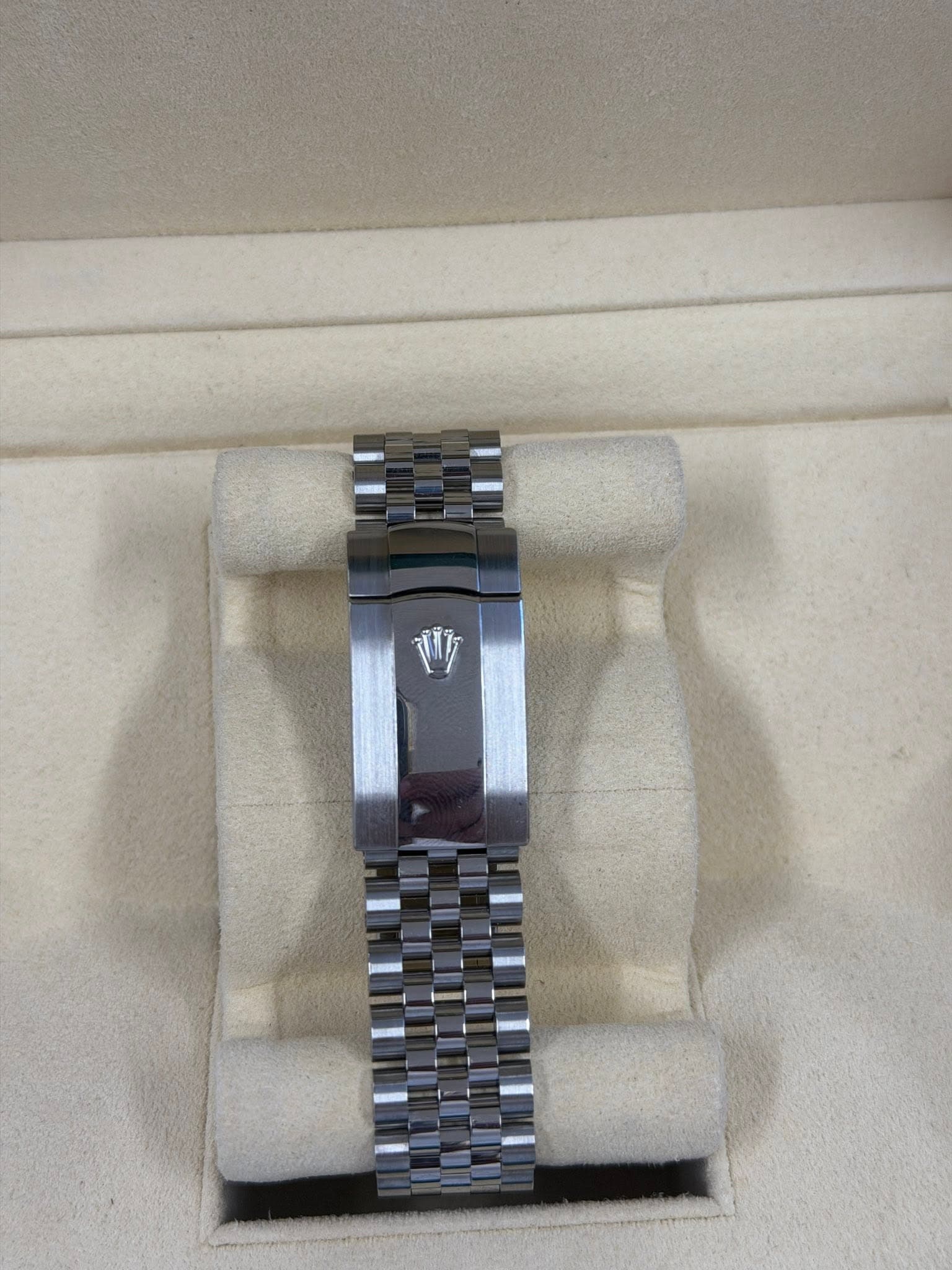 May be an image of wrist watch and text