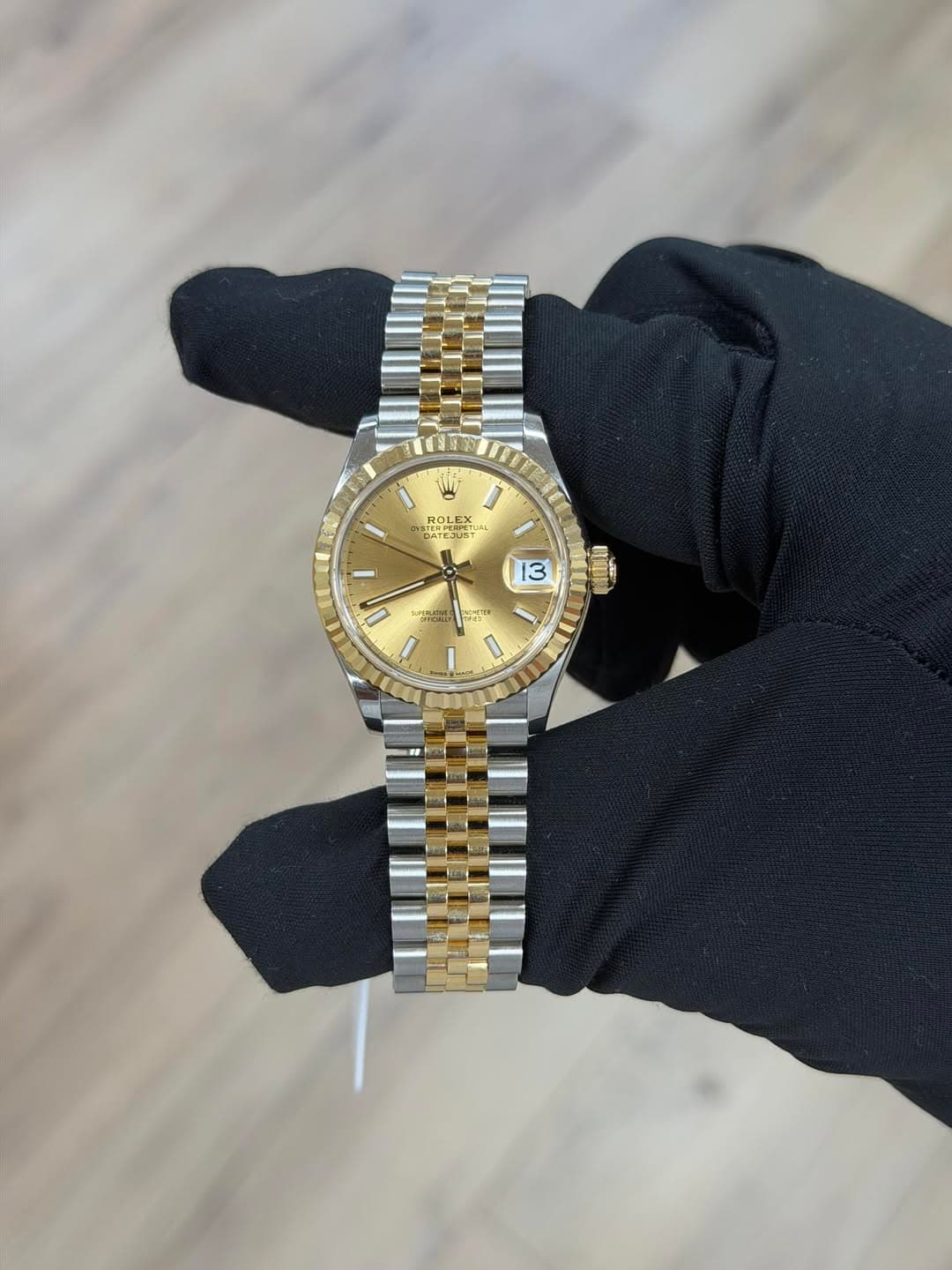 May be an image of wrist watch and text