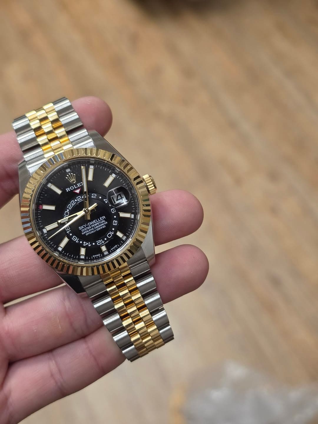 May be an image of wrist watch and text