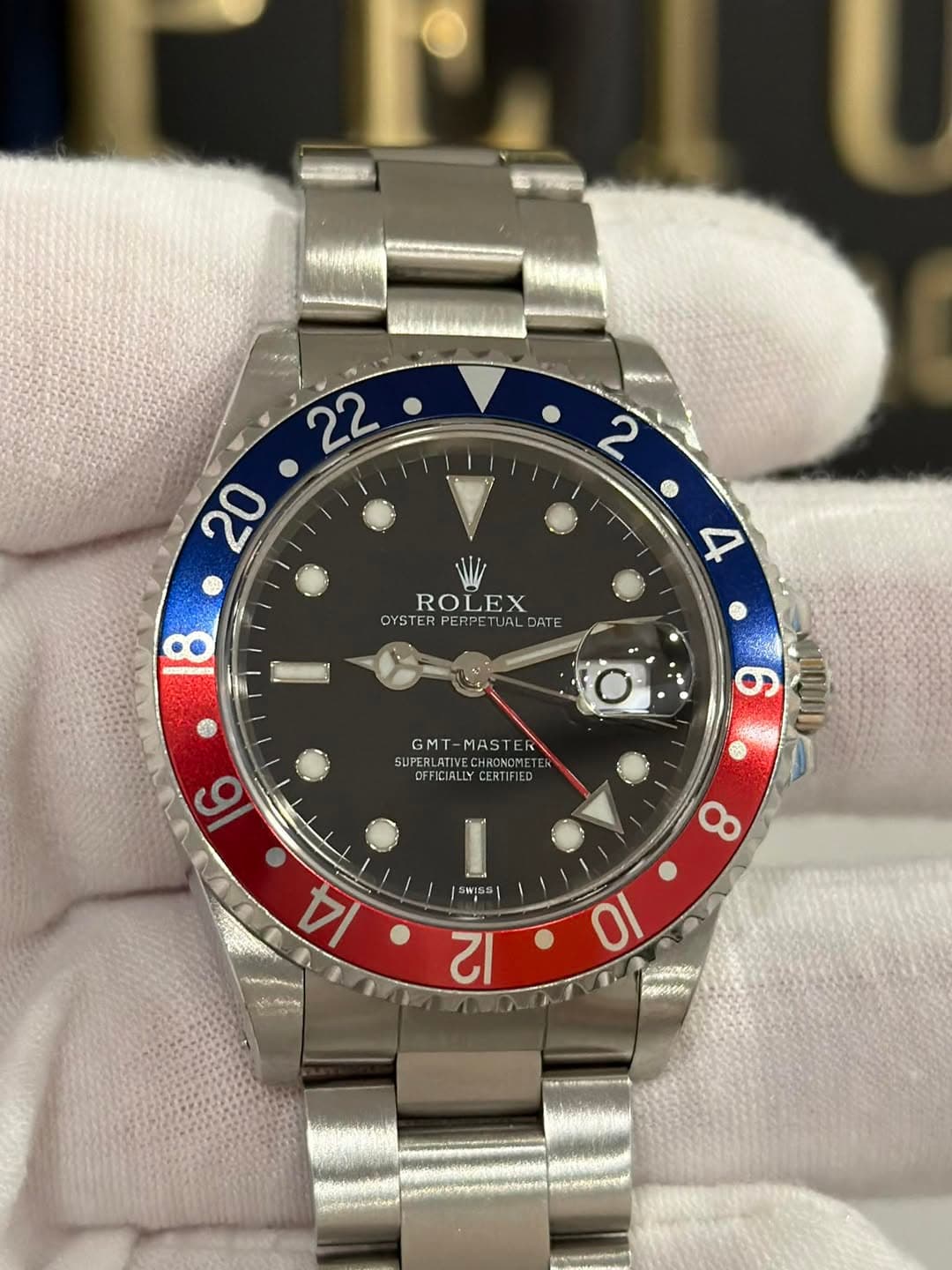 May be an image of wrist watch and text that says 'A ROLEX OYSTER PERPETUAL OYSTERPERPETURLDATE DATE 4 GMT A SV SUPERLATIVECHONOMETE SUPER UPERLATIV CHROKOMET DFFICIALLY…