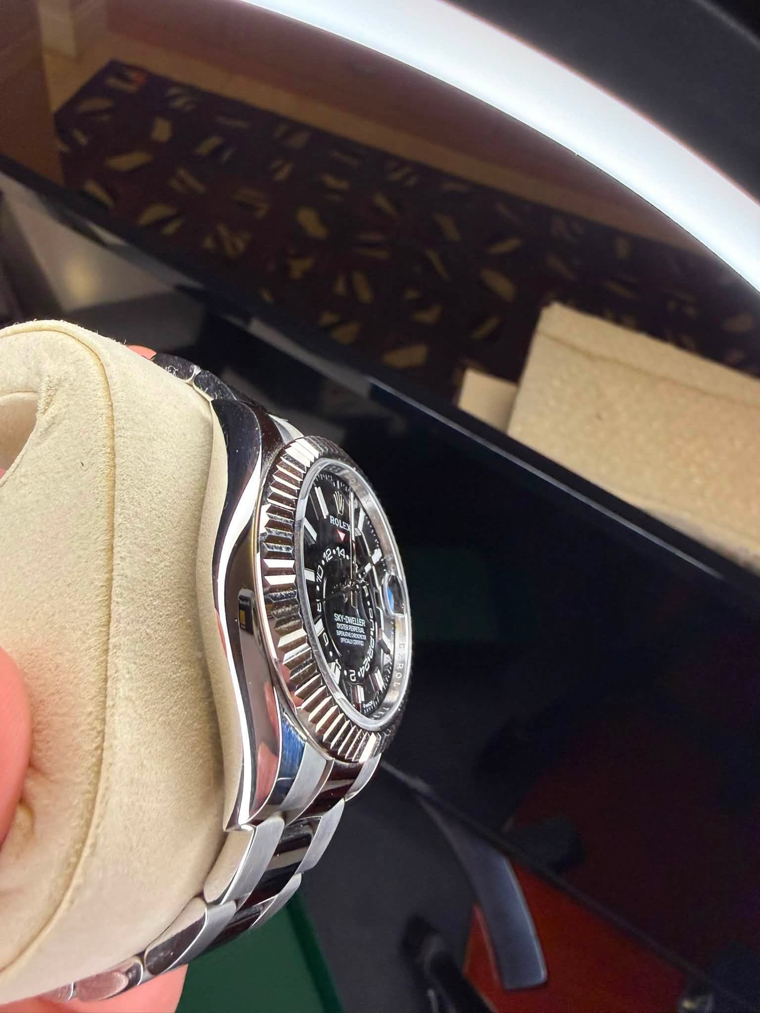 May be an image of wrist watch and text