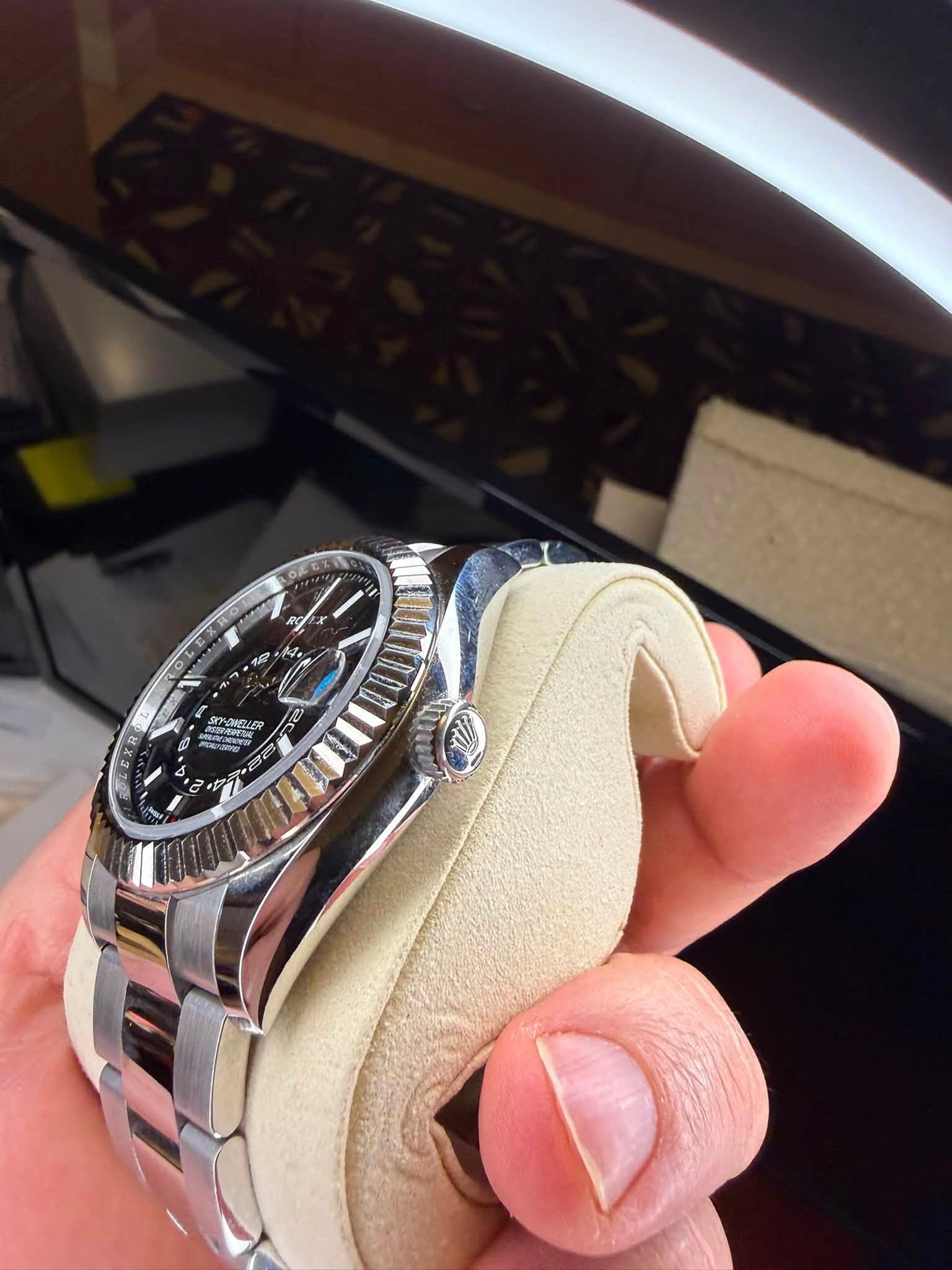 May be an image of wrist watch and text