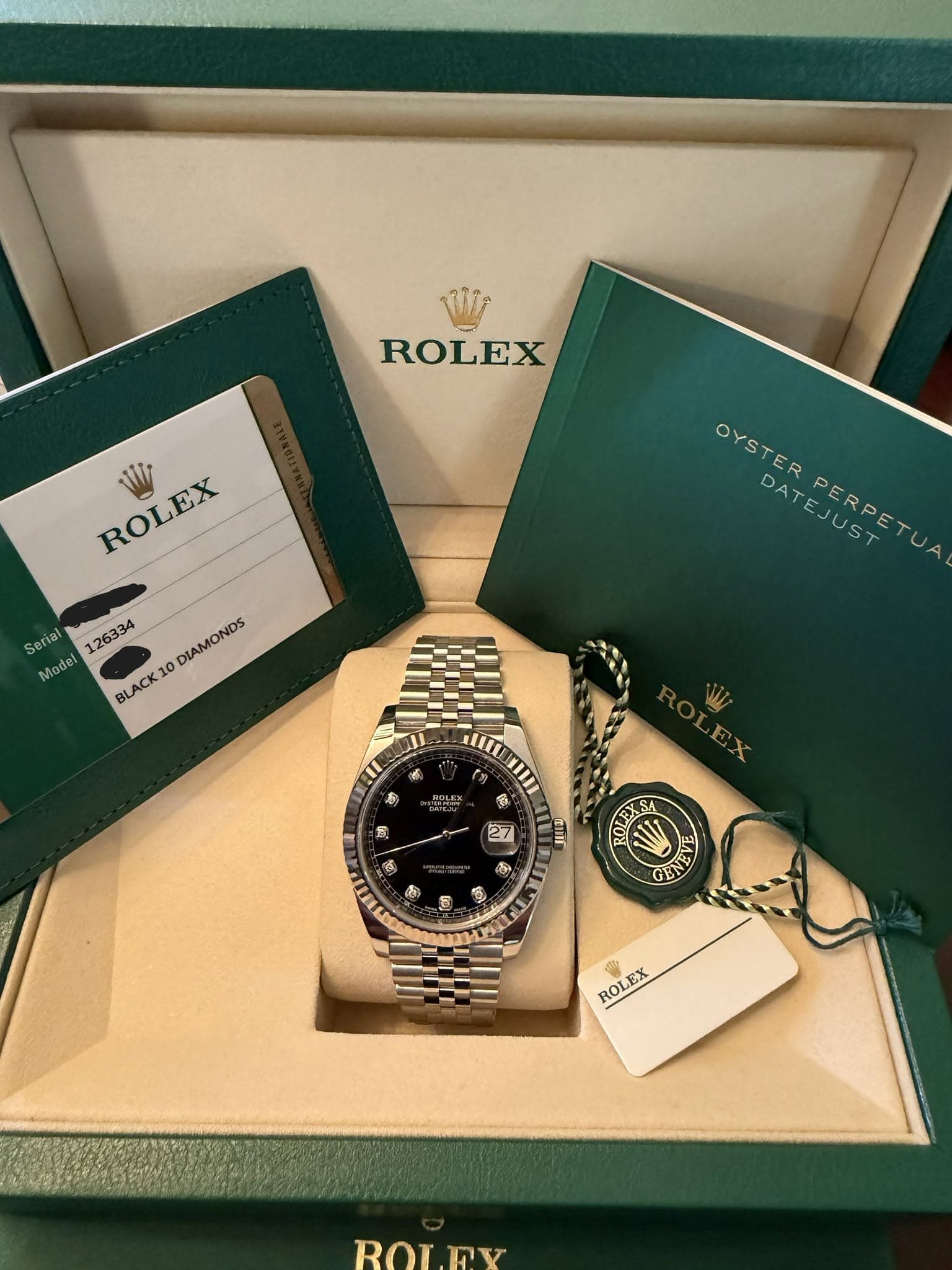 May be an image of wrist watch and text that says 'ROLEX ROLEX EX WI Serial 126334 Madel BLACK 10 O DIAMONDS OYSTERPERPETUA DAT OYSTER DATEJUST PERPETU III S マ 者 感 ก 27 PIELI ወ…