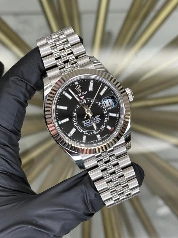May be an image of wrist watch and text